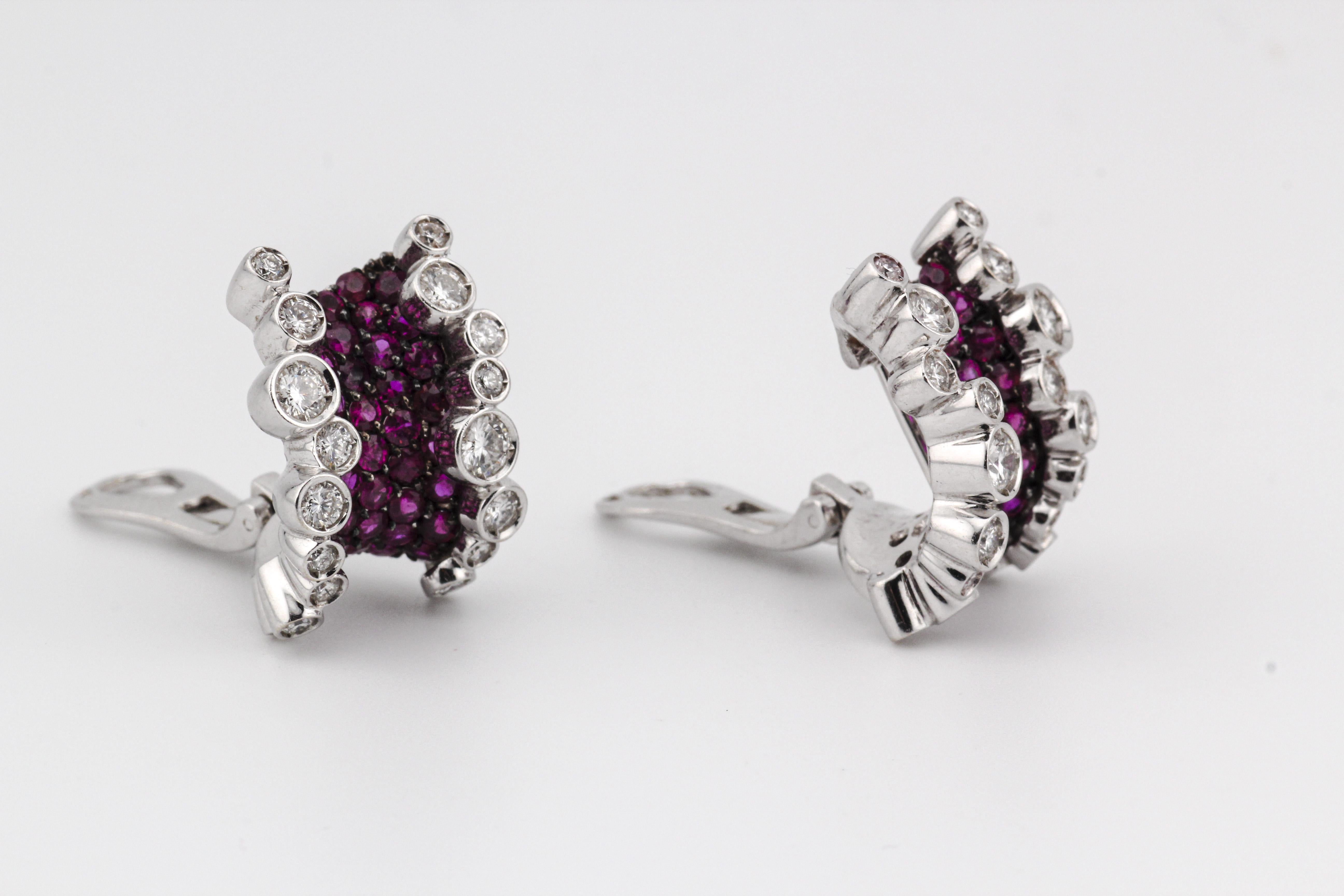 The Stefan Hafner Ruby Diamond 18K White Gold Corset Earrings are a mesmerizing blend of elegance and artistry, meticulously crafted to captivate the senses. Designed by the renowned jewelry designer Stefan Hafner, these earrings exude