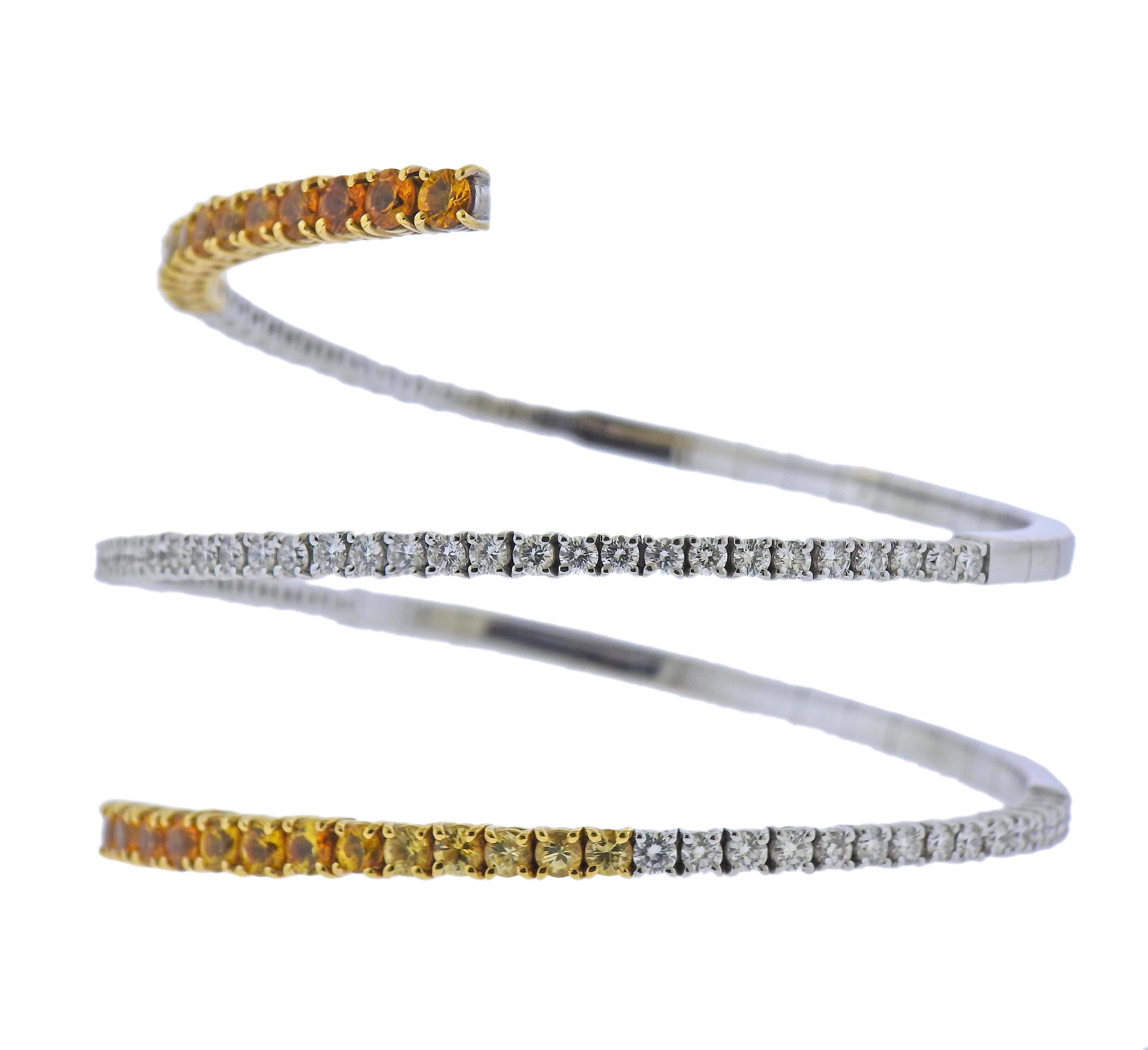 Stefan Hafner 18k white gold wrap bracelet, with 4.07ctw orange and yellow sapphires and 3.27ctw in diamonds. Bracelet will fit approx. 7