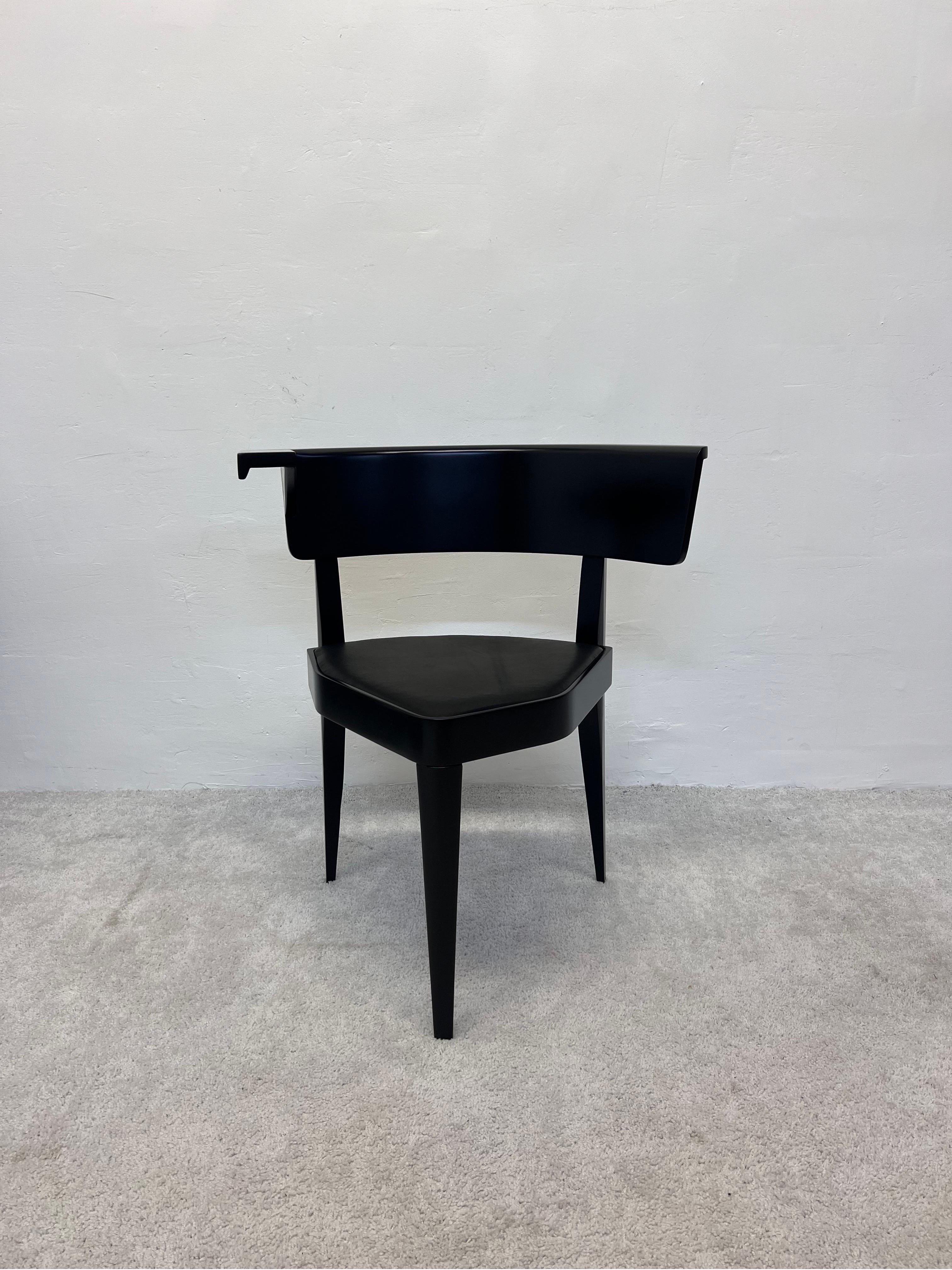 Fully restored three legged, asymmetric B1 chair by Stefan Wewerka for Tecta. Originally designed in 1979, this example is from circa 1980s. Cushioned soft black leather seat fits snugly in a satin black lacquered frame.

The B1 stands solidly on