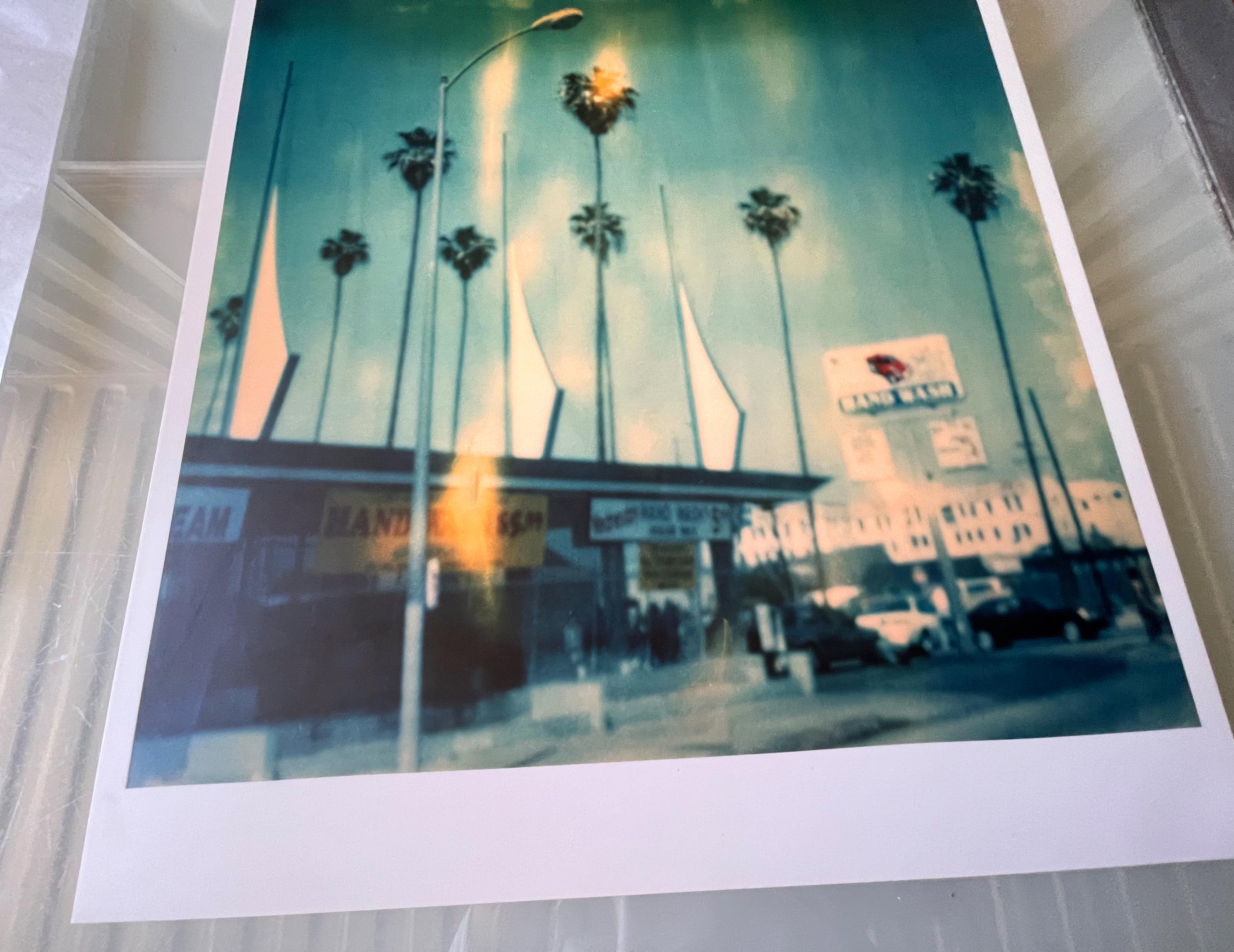 Car Wash (Stranger than Paradise) - 1999

64.6x59.5cm including the white 'Polaroid' frame.  
Edition 2/10. 
Analog C-Print, hand-printed by the artist, 
mounted on Aluminum with matte UV-Protection, based on the original Polaroid. 
Artist inventory