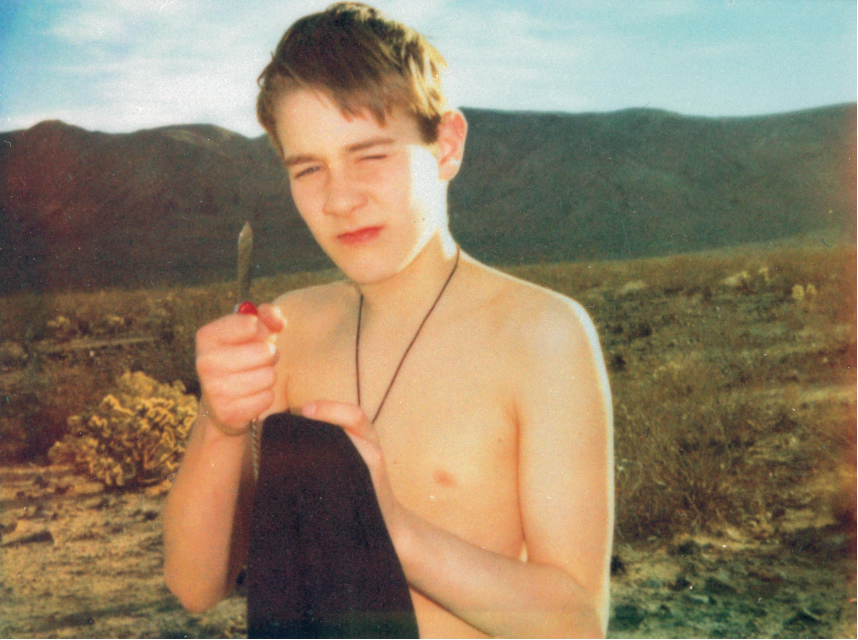 Stefanie Schneider Color Photograph - Felix with Knife (California Bluescreen)