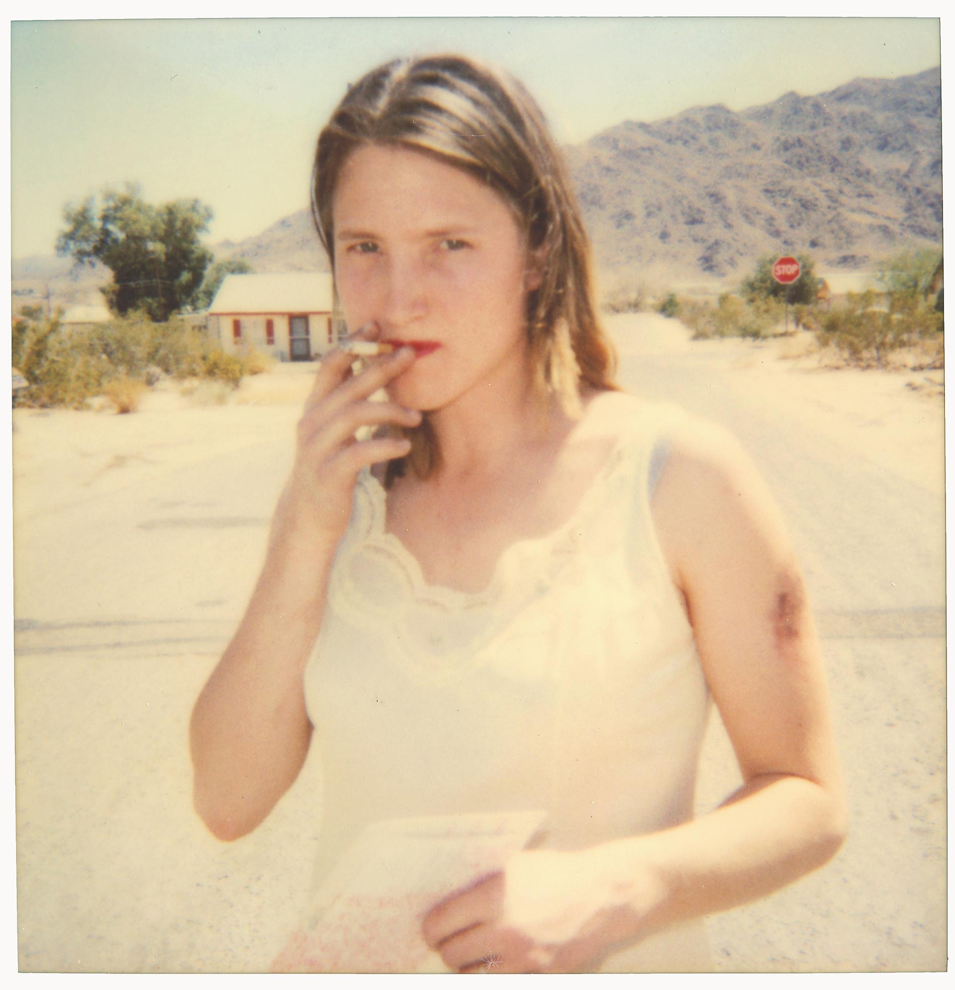 Stefanie Schneider Portrait Photograph - Kirsten smokes (29 Palms, CA) - Polaroid, Contemporary