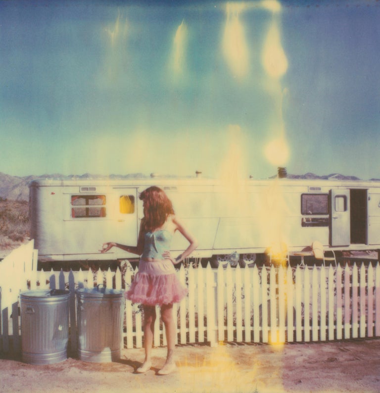 Stefanie Schneider Color Photograph - Making Magic (The Girl behind the White Picket Fence) based on a Polaroid