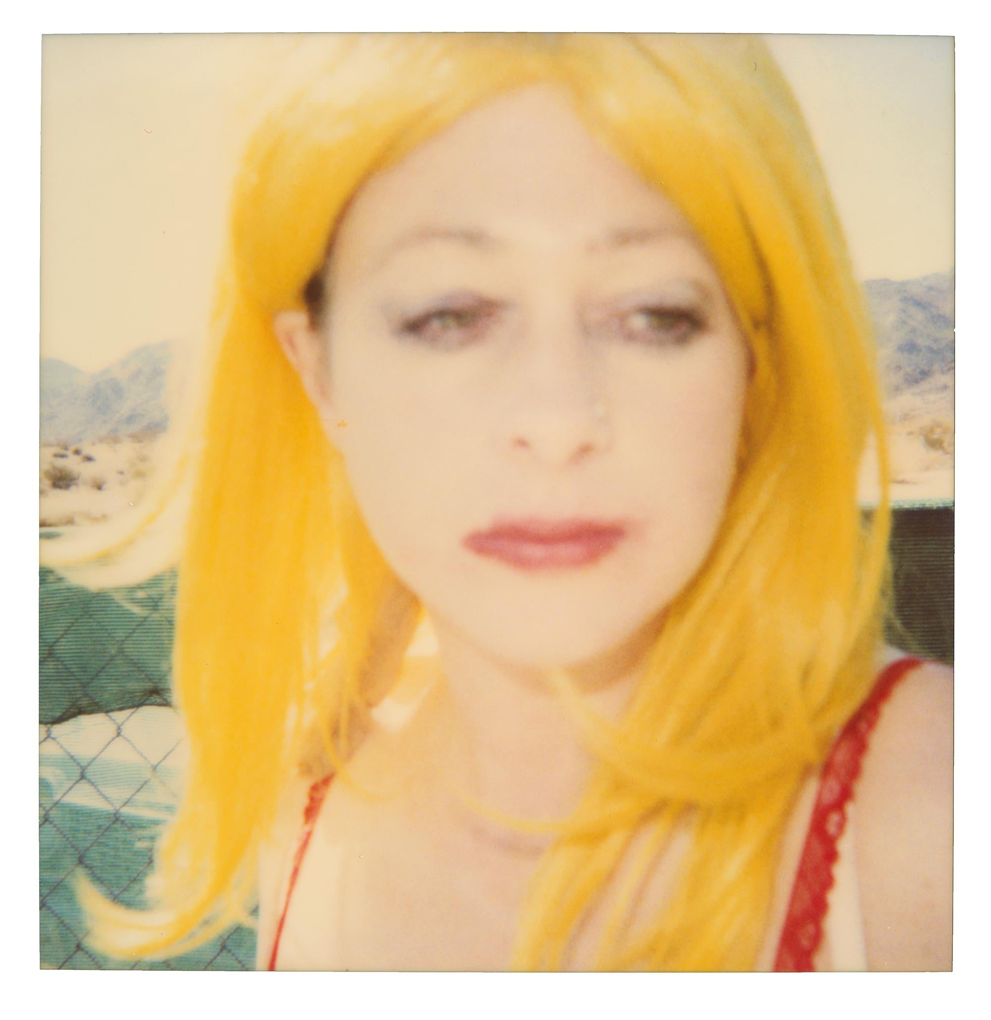 Max in front of Motel (29 Palms, CA) - analog, Polaroid, Contemporary - Orange Still-Life Photograph by Stefanie Schneider