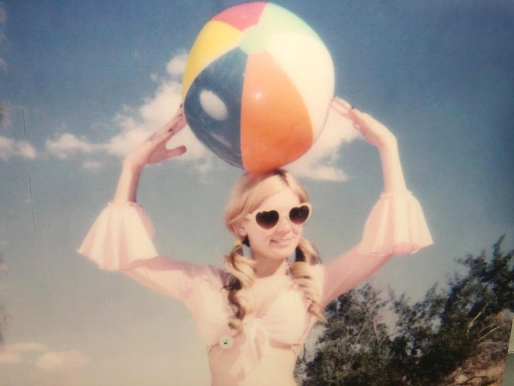 Miss Moneypenny with Beach Ball (Heavenly Falls) - Beige Color Photograph by Stefanie Schneider
