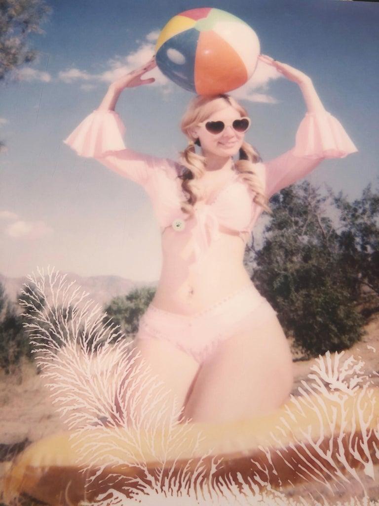 Moneypenny with Beach Ball (Heavenly Falls) - Polaroid, Contemporary, Bond - Photograph by Stefanie Schneider
