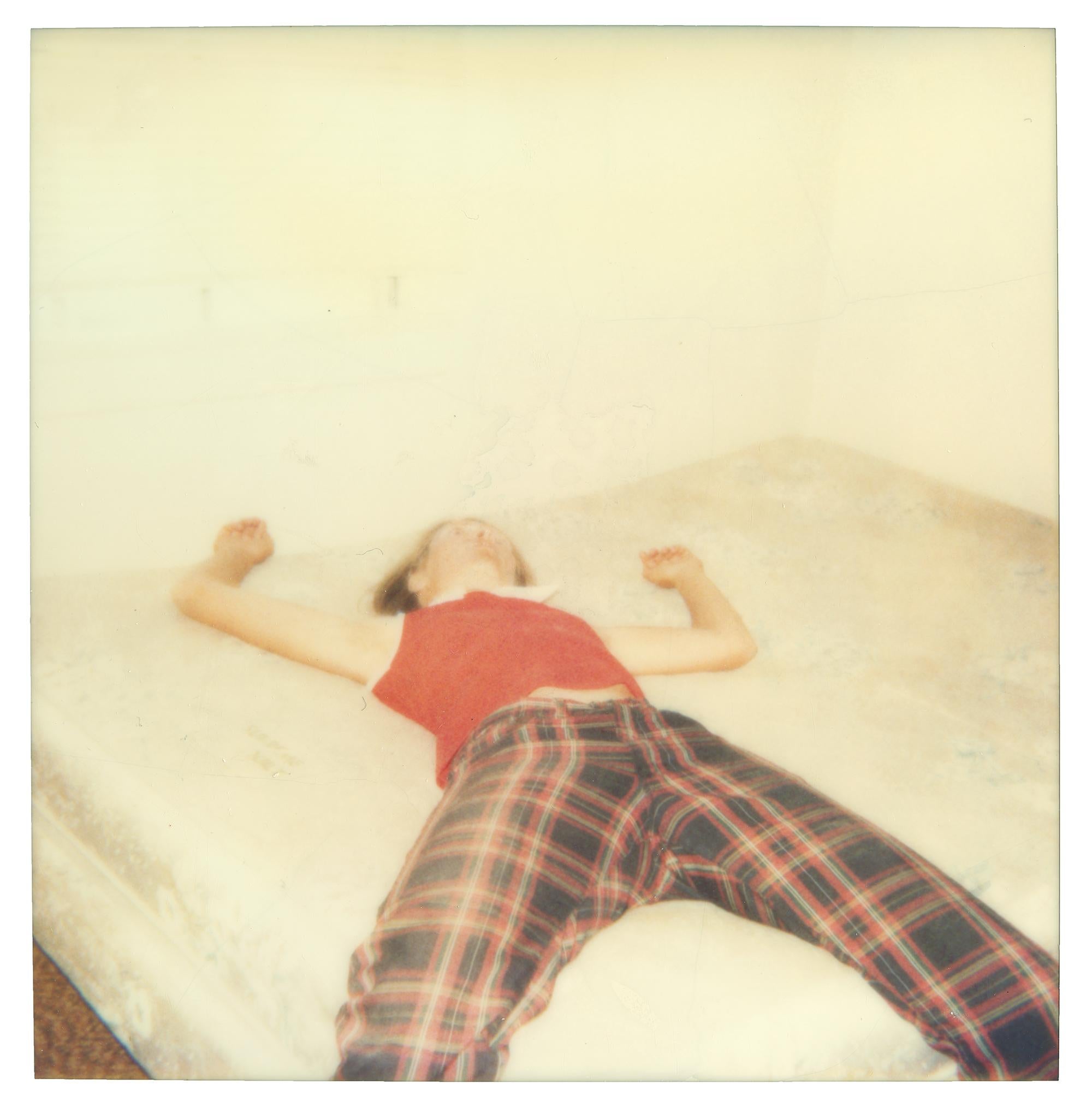 Stefanie Schneider Color Photograph - Stefanie on bed looking quite dead (29 Palms, CA) - Analog, Polaroid, mounted
