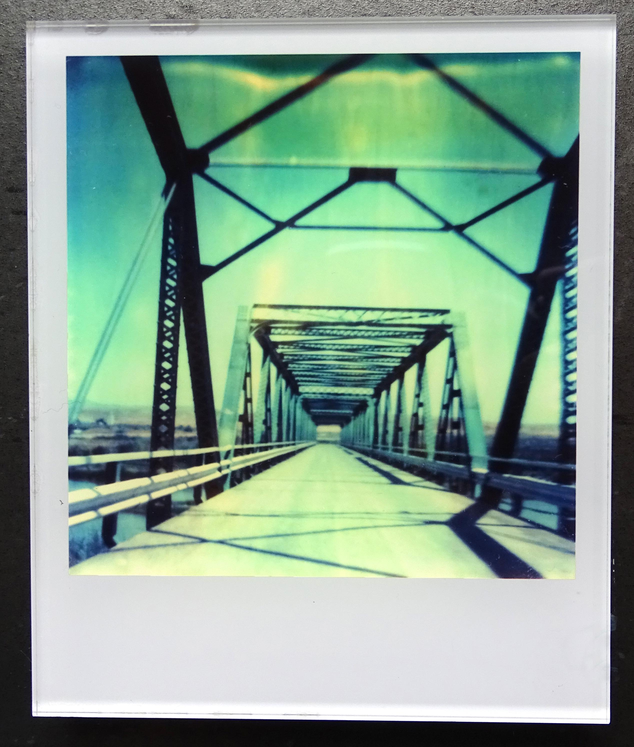 Stefanie Schneider's Minis
'Blue Bridge' (29 Palms, CA), 1999
signed and signature brand on verso
Lambda digital Color Photographs based on a Polaroid

Polaroid sized open Editions 1999-2013
10.7 x 8.8cm (Image 7.9x7.7cm)
mounted: sandwiched in