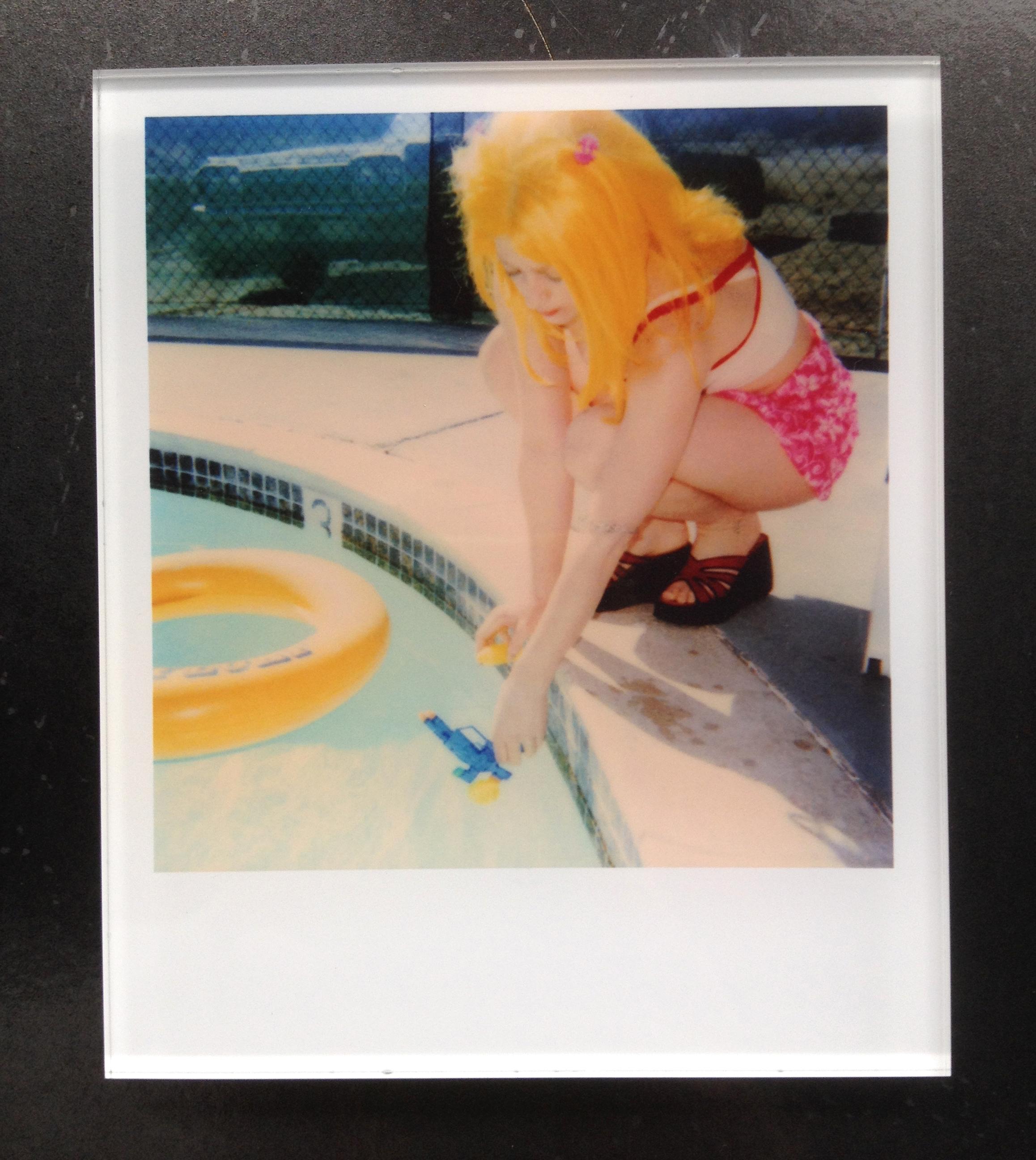 Stefanie Schneider's Minis
'Max by the Pool' (29 Palms, CA), 1999
signed and signature brand on verso
Lambda digital Color Photographs based on a Polaroid

Polaroid sized open Editions 1999-2013
10.7 x 8.8cm (Image 7.9x7.7cm)
mounted: sandwiched in