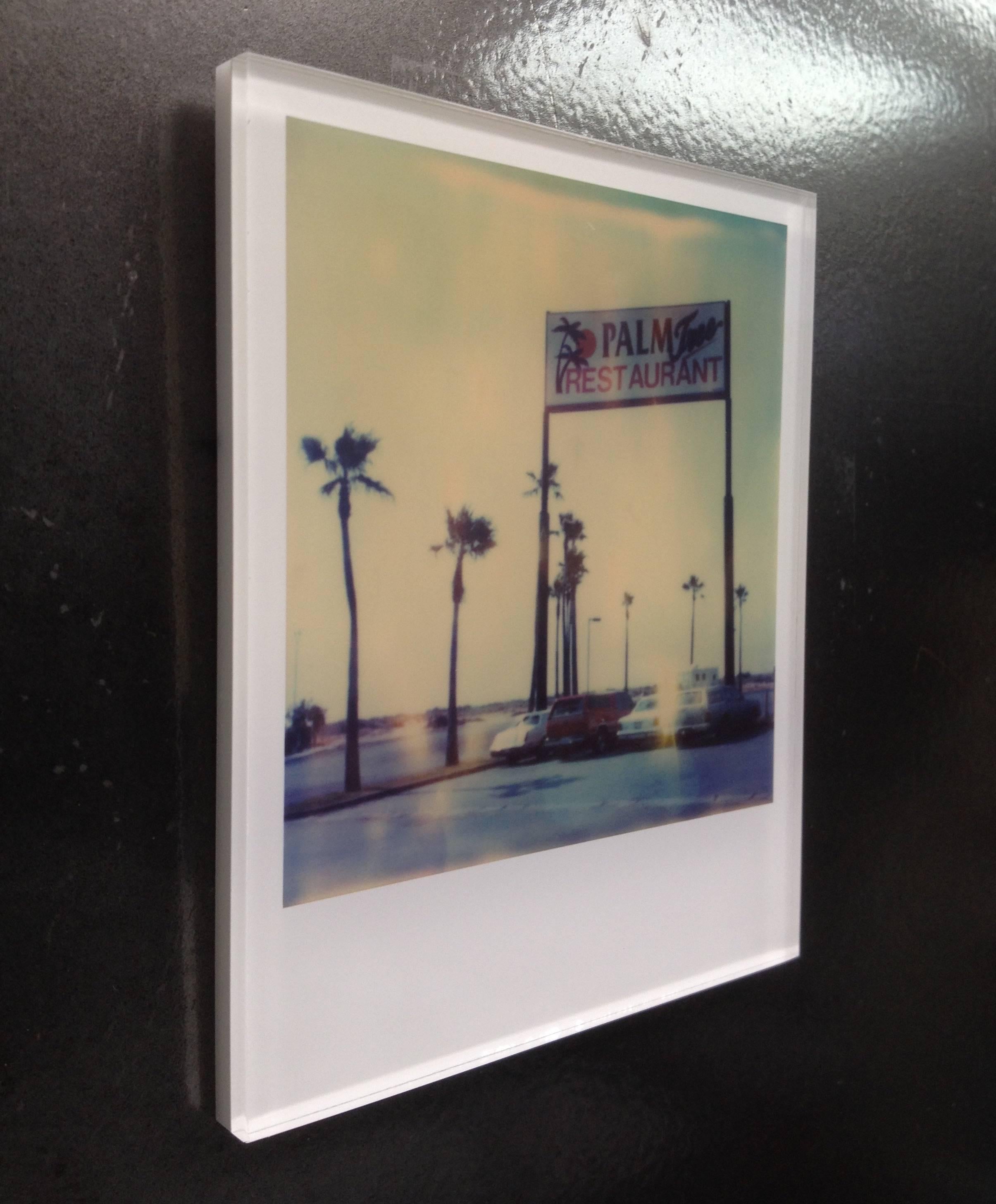 Stefanie Schneider's Minis
Palm Tree Restaurant, 1999

signed and signature brand on verso
Lambda digital Color Photographs based on a Polaroid

Polaroid sized open Editions 1999-2013
10.7 x 8.8cm (Image 7.9x7.7cm)
mounted: sandwiched in between