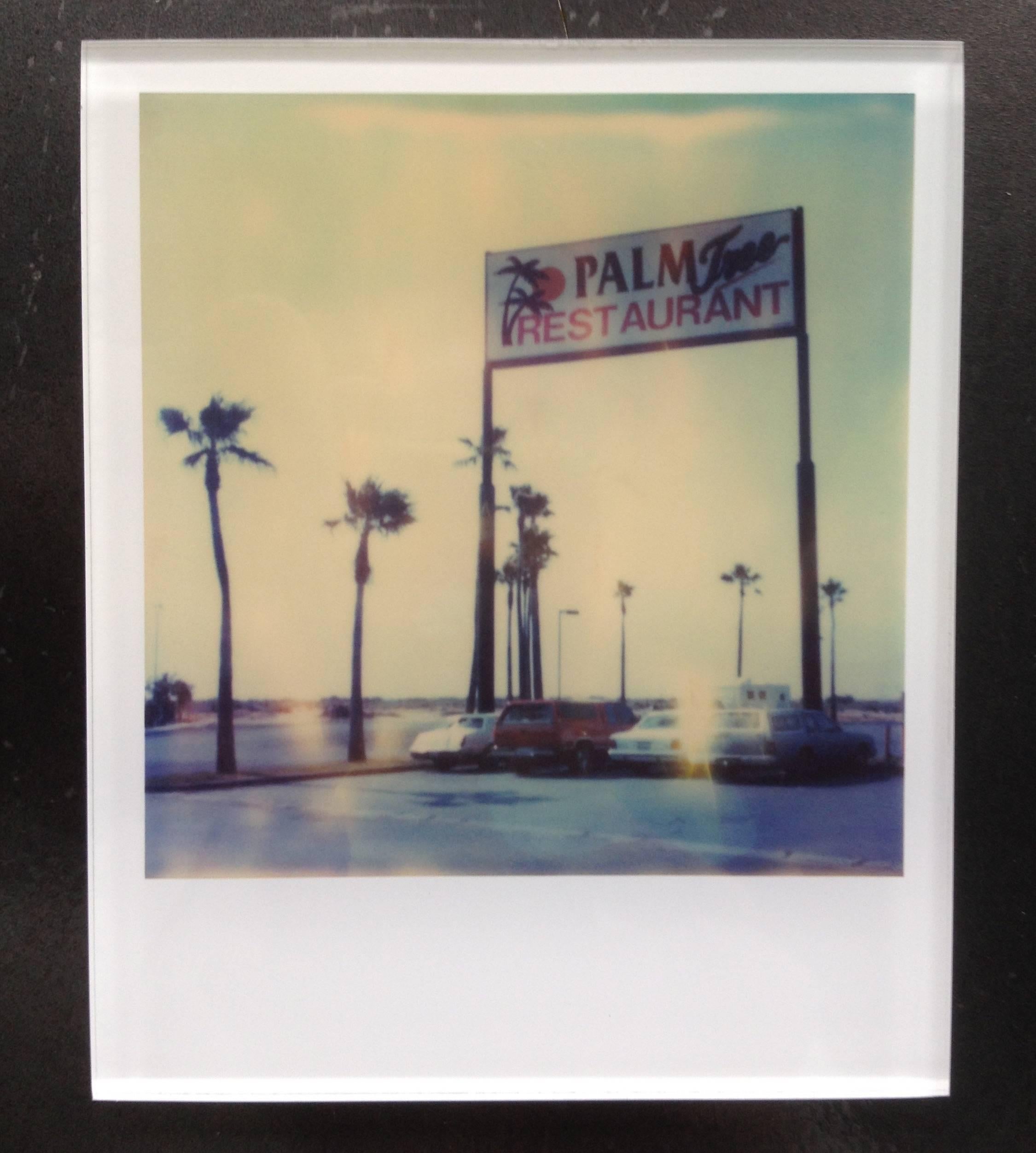 Stefanie Schneider's Minis
'Palm Tree Restaurant', 1999
signed and signature brand on verso
Lambda digital Color Photographs based on a Polaroid

Polaroid sized open Editions 1999-2013
10.7 x 8.8cm (Image 7.9x7.7cm)
mounted: sandwiched in between