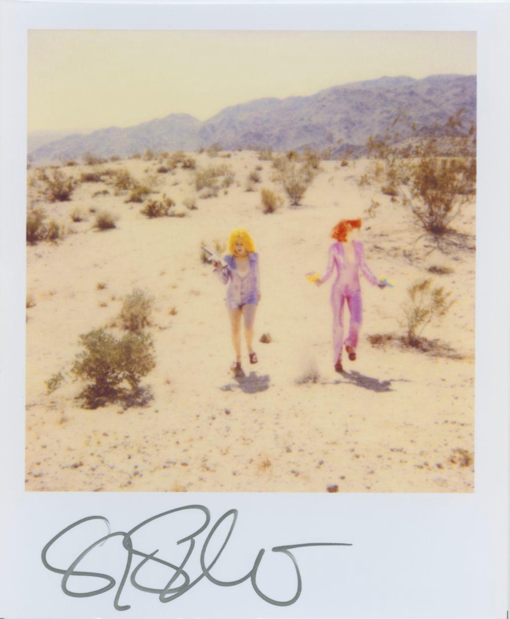 Stefanie Schneider Polaroid-sized unlimited Mini 'Running with Guns' - 1999 - 

signed in front, not mounted. 
1 Digital Color Photographs based on a Polaroid. 

Polaroid sized open Editions 1999-2016
10.7 x 8.8cm (Image 7.9x7.7cm) each.

Stefanie