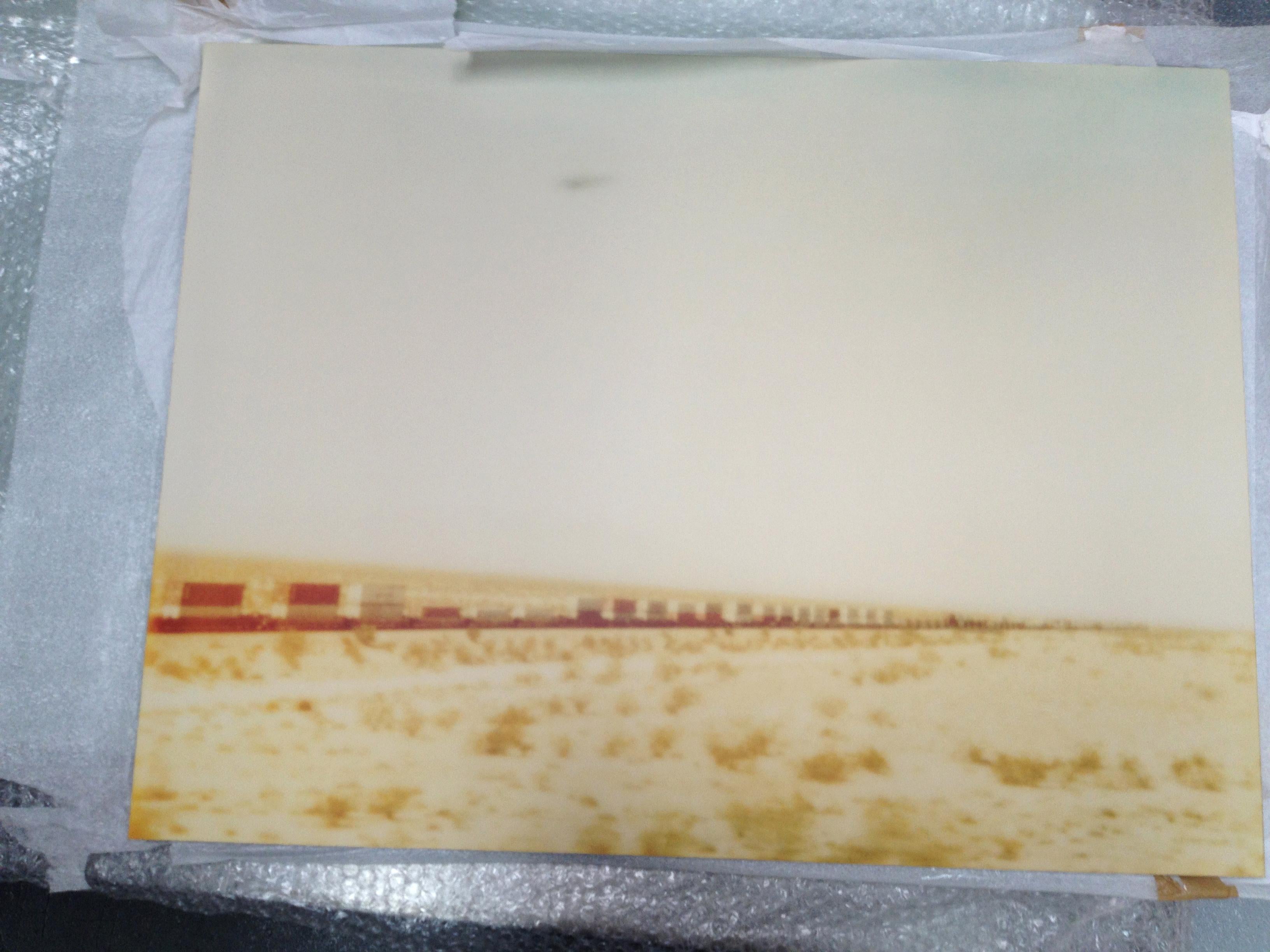 Train crosses Plain (Wastelands) - analog hand-print, mounted - Polaroid, Color - Photograph by Stefanie Schneider