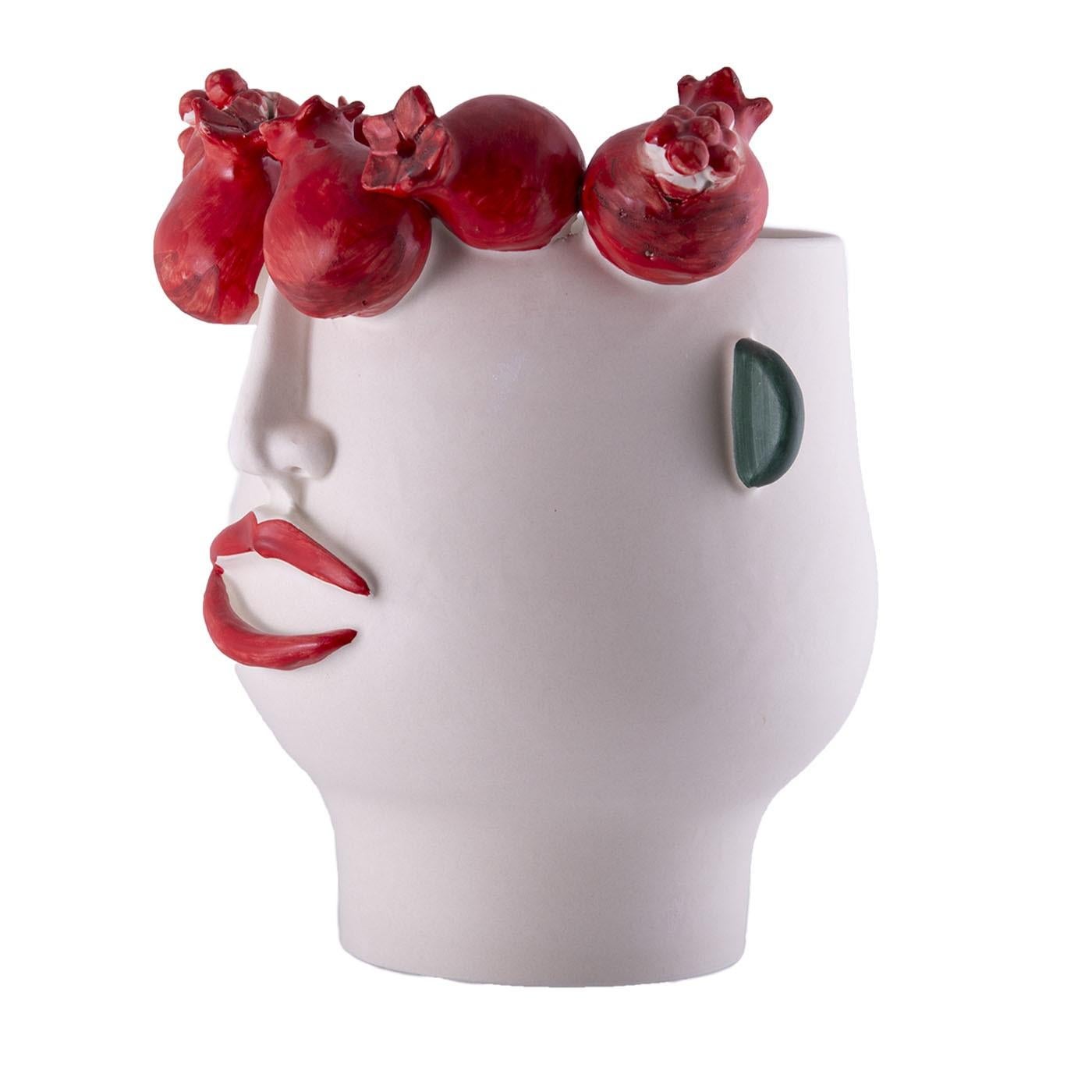 Testament to the Sicilian tradition of Moor's head reinterpreted in a stylish contemporary key, this ceramic head can be used as a flower pot or decorative sculpture for indoor and outdoor settings of any style inspiration. Adorned with a wreath of