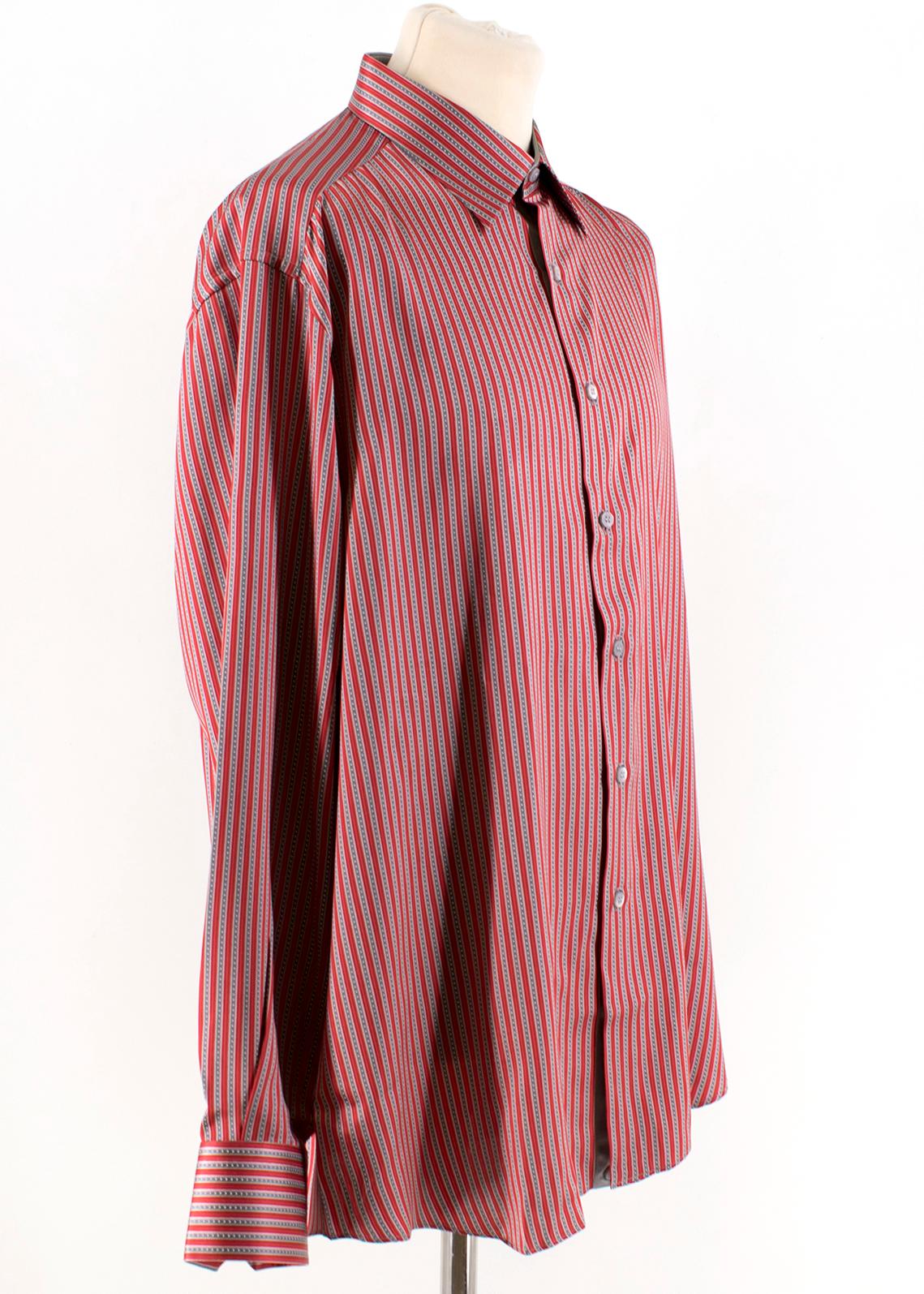 Stefano Ricci For Saint-Phil Red and Grey Striped Silk Shirt

- Red and Grey Striped  Shirt 
- 100% Silk 
- Stiff point collar and sleeves 
- Grey buttoned down center front and sleeves 

Please note, these items are pre-owned and may show some