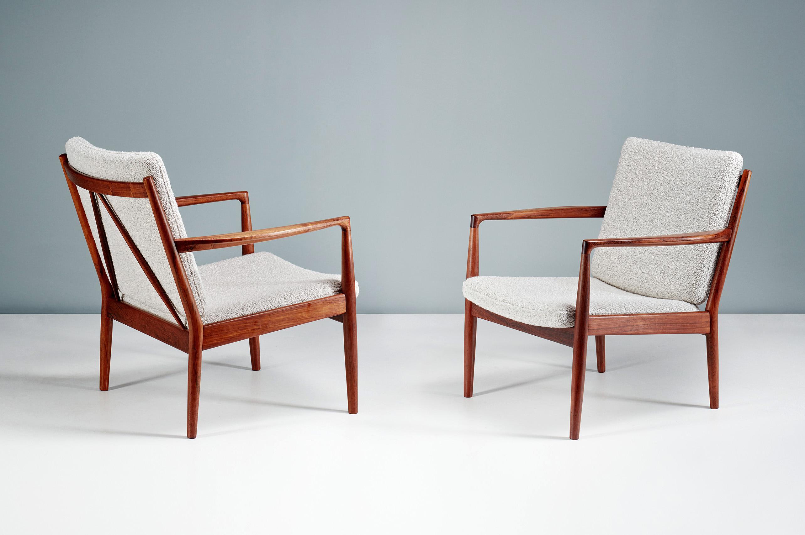 Steffen Syrach-Larsen - Lounge Chairs, c1960s

A pair of incredibly rare rosewood lounge chairs produced by Gustav Bertelsen in Denmark in the 1960s. The frames feature sculptural blade arms and angled back slats. The seat and back have been