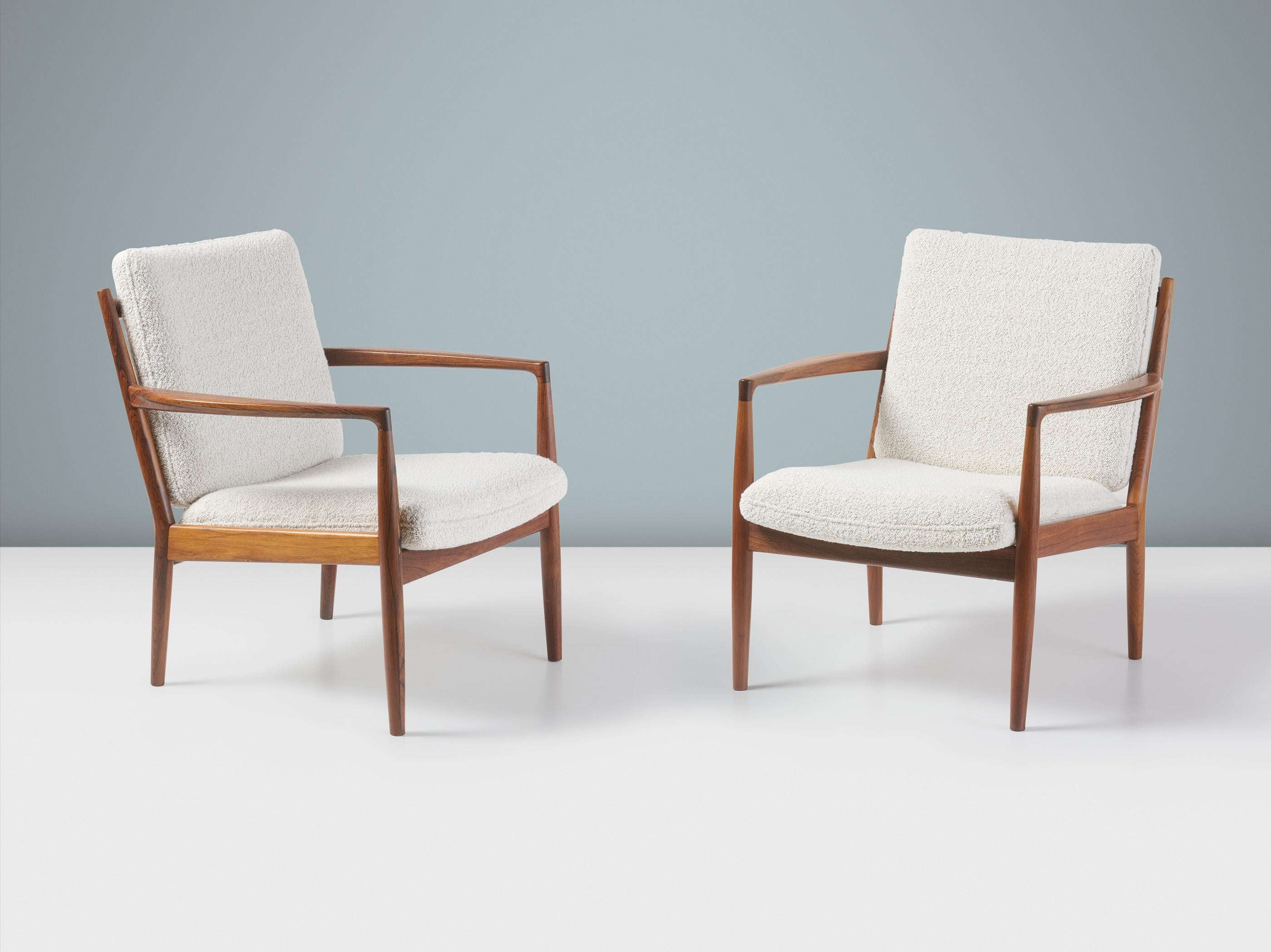 Steffen Syrach-Larsen - Lounge Chairs, c1960s

A pair of incredibly rare rosewood lounge chairs produced by Gustav Bertelsen in Denmark in the 1960s. The frames feature sculptural blade arms and angled back slats. The seat and back have been