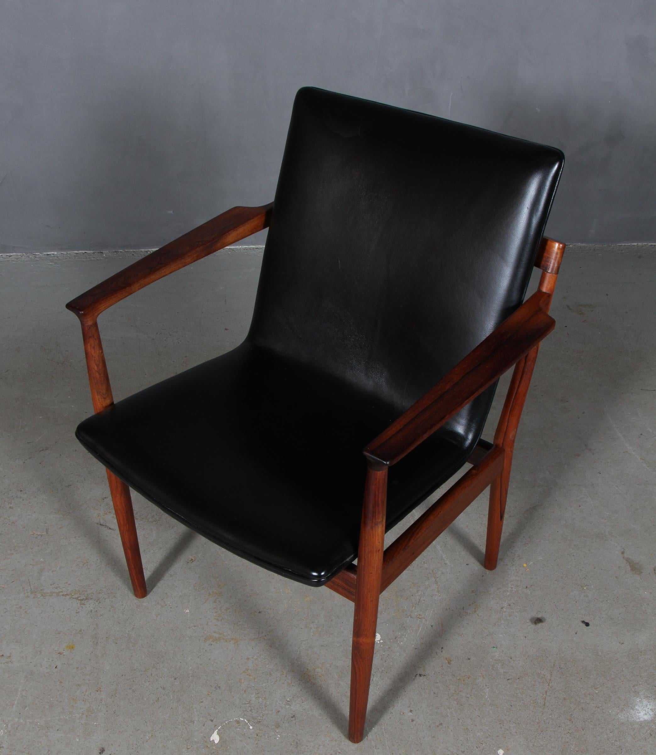 Steffen Zyrach Larsen armchair in rosewood with original black leather.

Made by Gustav Bertelsen.