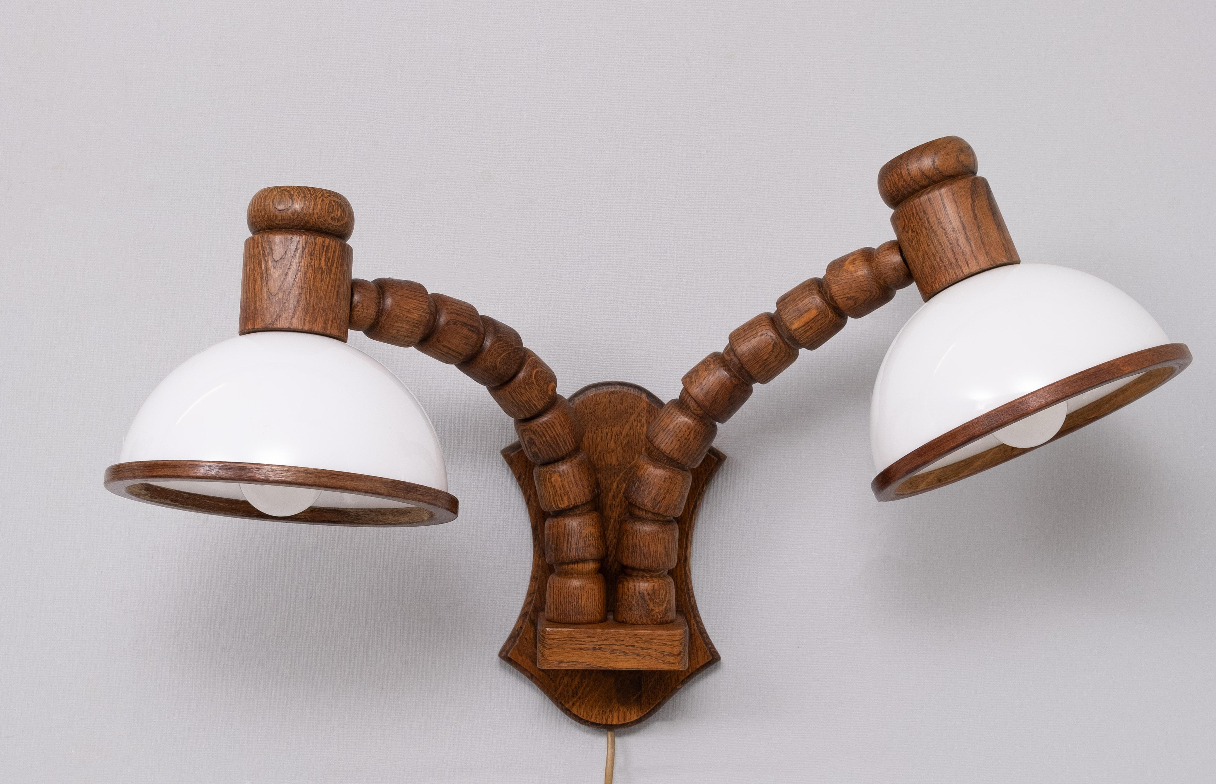 Very nice set of Wall lamps . Flexible Oak wooden arms . 
One lamp with Two arms and one with one arm . 
Plexiglass shades . Large E27 bulbs needed .Manufactured by Steinhauer .
1970s Holland .  Very good condition 