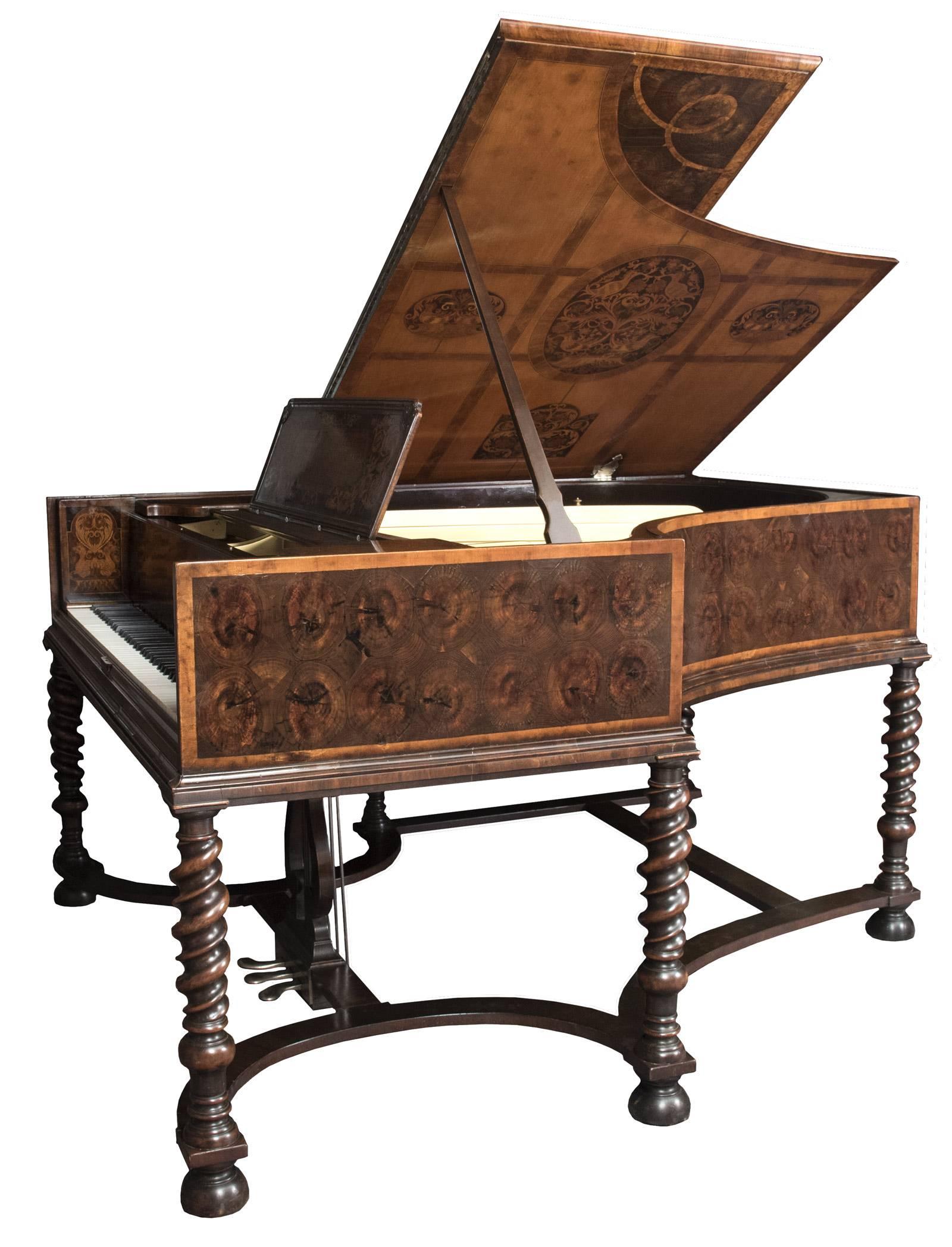 An extraordinary 19th century Steinway concert grand piano with a case that is entirely decorated with butt cut veneer and ornate inlay marquetry designs on all sides, including the lid and fall board, and raised on six carved twisting legs, the
