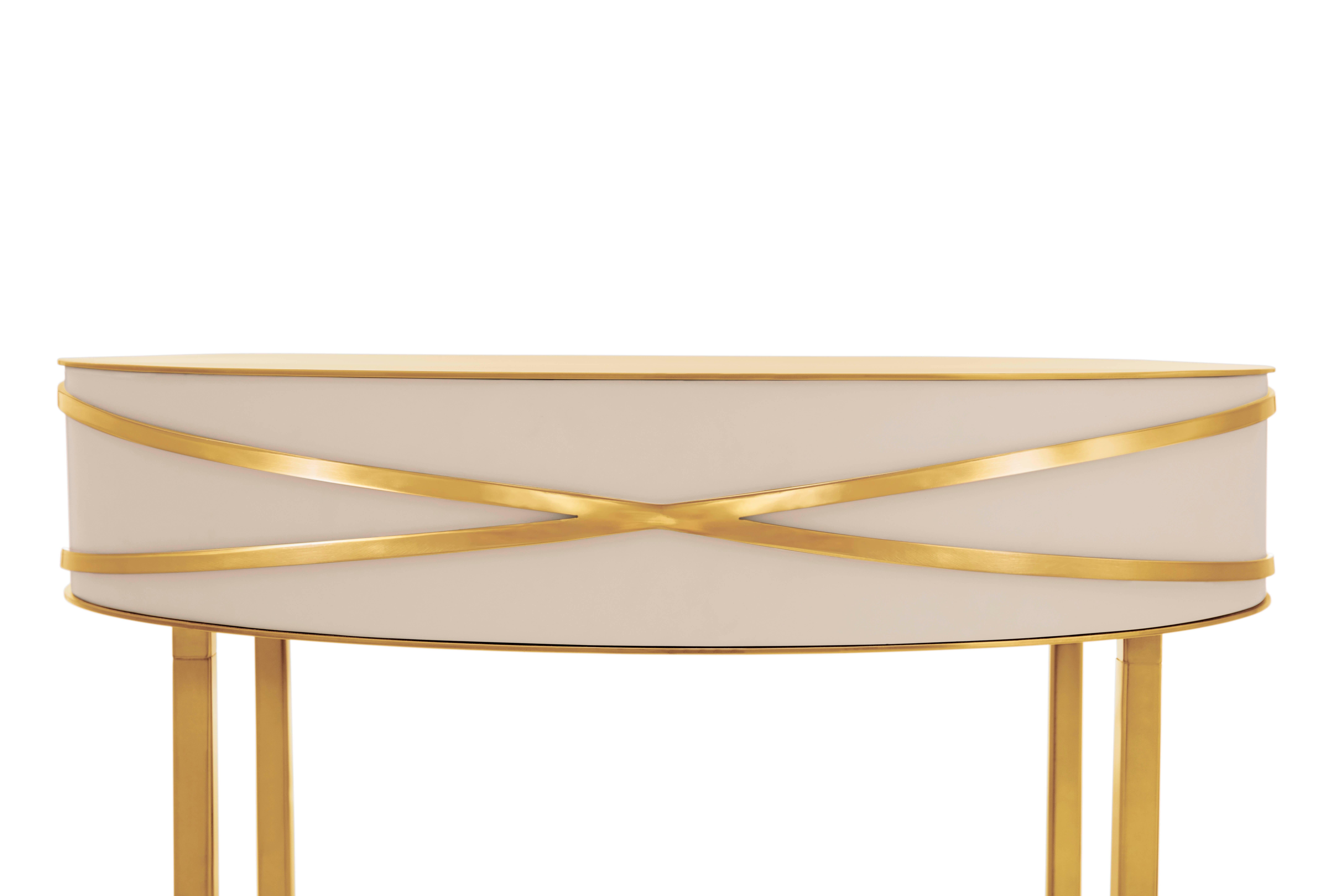 Stella Gray Console or Bedside Table with Gold Trims by Nika Zupanc is a chic gray table with a drawer, and gold metal trims.

Nika Zupanc, a strikingly renowned Slovenian designer, never shies away from redefining the status quo of design, moving