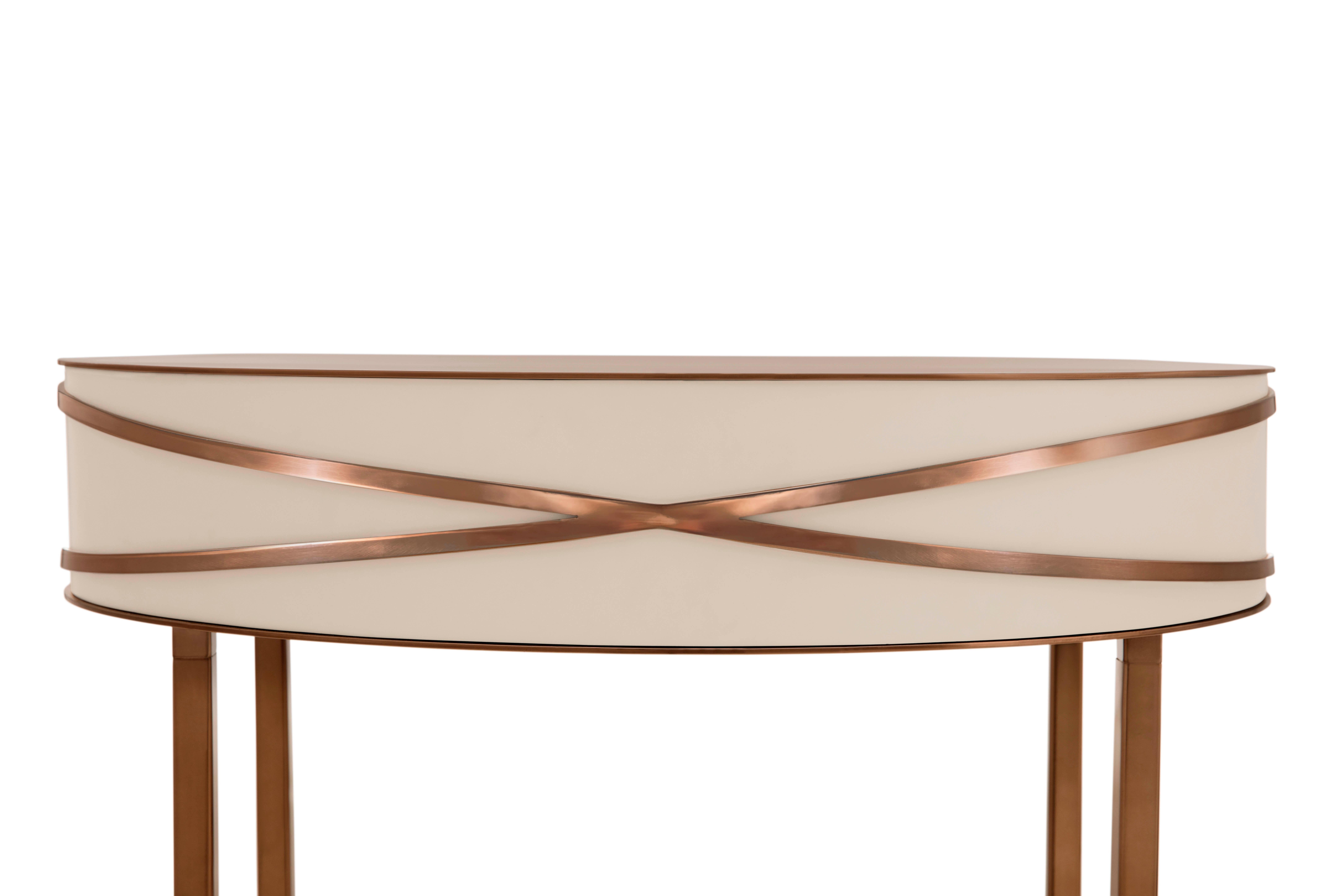 Stella Gray Console or Bedside Table with Rose Gold Trims by Nika Zupanc is a chic gray table with a drawer and rose gold metal trims.

Nika Zupanc, a strikingly renowned Slovenian designer, never shies away from redefining the status quo of design,