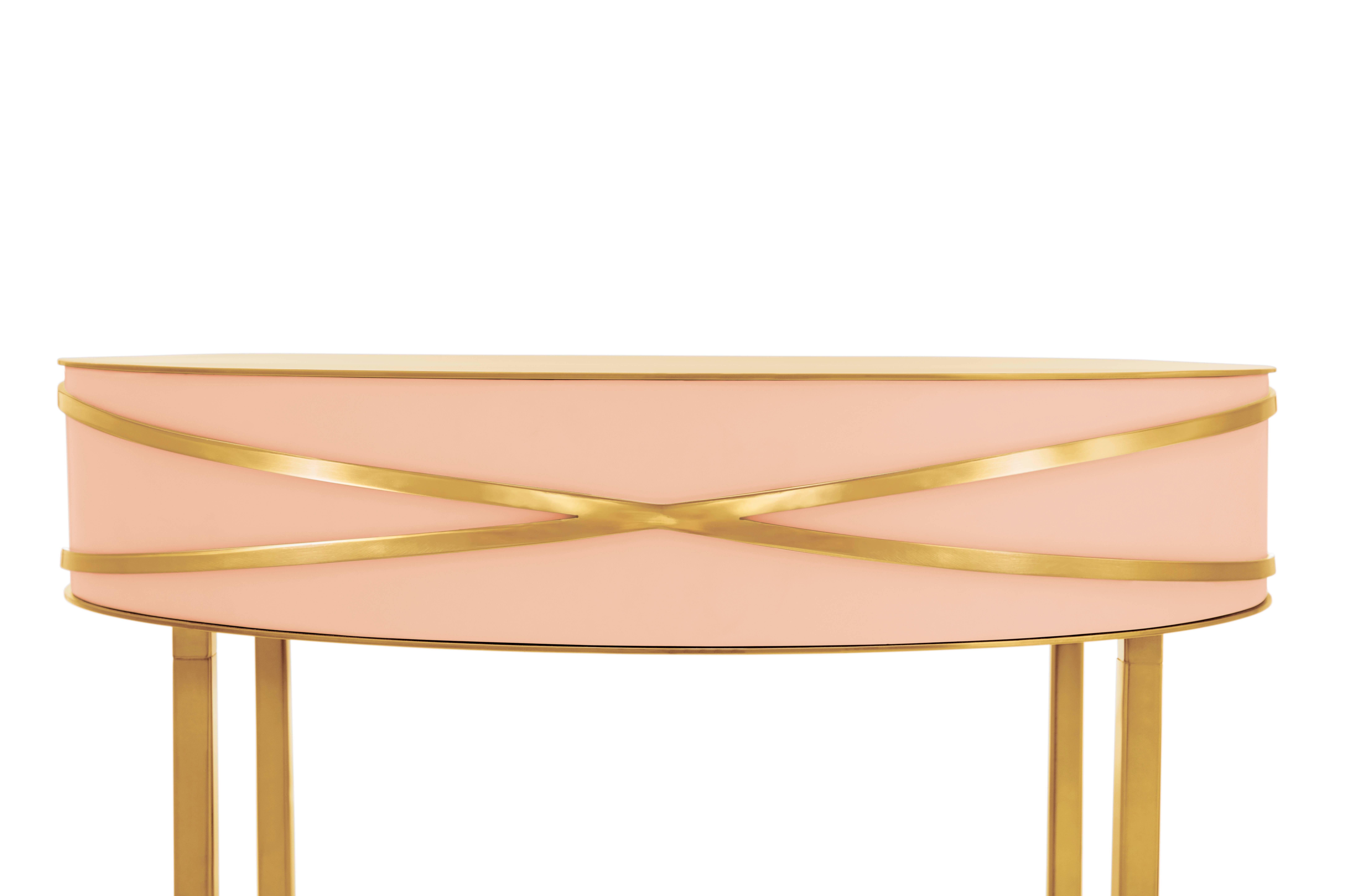 Stella Pink Console or Bedside Table with Gold Trims by Nika Zupanc is a pink console table with a drawer and metal trims in gold.

Nika Zupanc, a strikingly renowned Slovenian designer, never shies away from redefining the status quo of design,