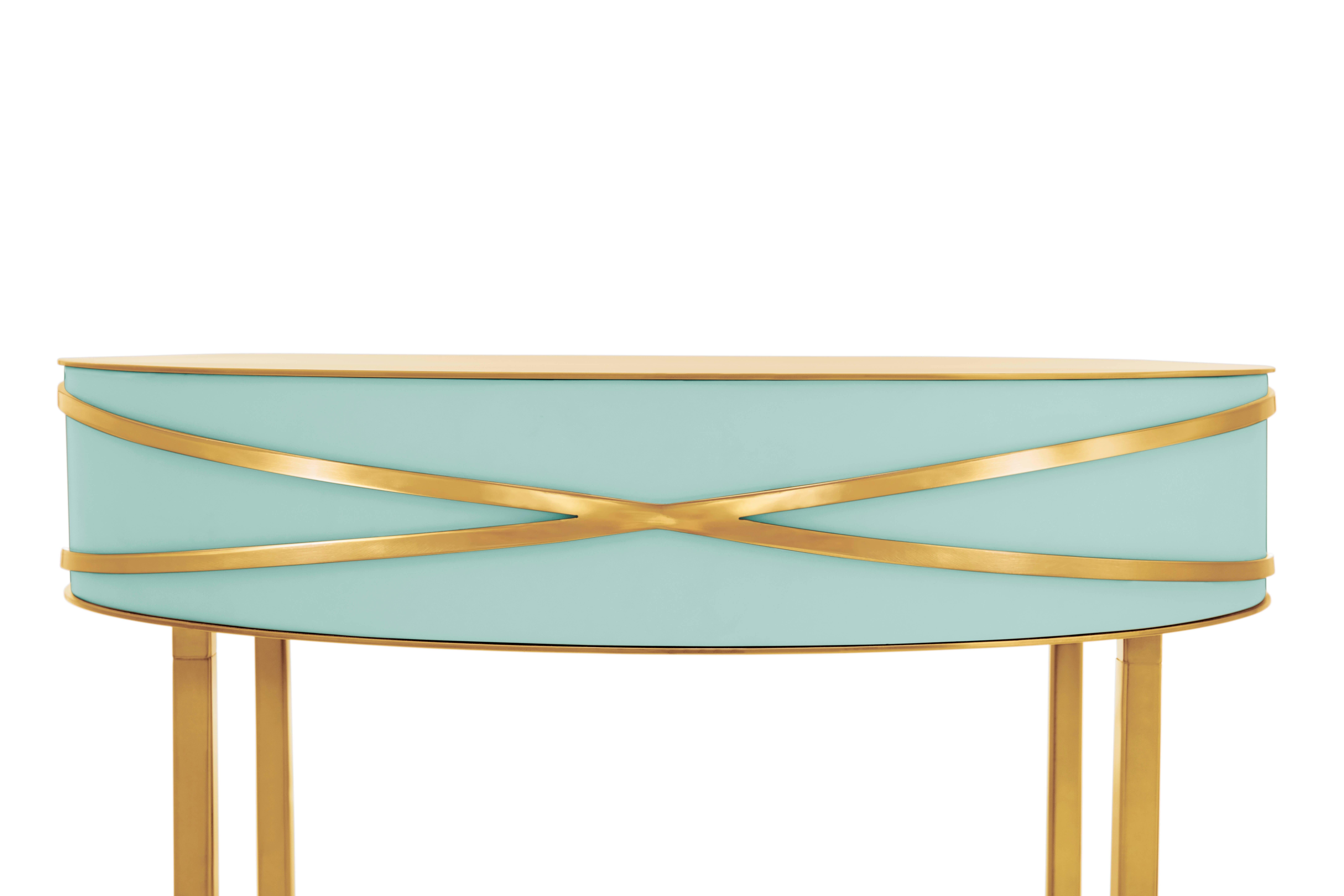 Stella Mint Green Console or Bedside Table with Gold Trims by Nika Zupanc is a mint green console table with a drawer, and metal trims in gold.

Nika Zupanc, a strikingly renowned Slovenian designer, never shies away from redefining the status quo