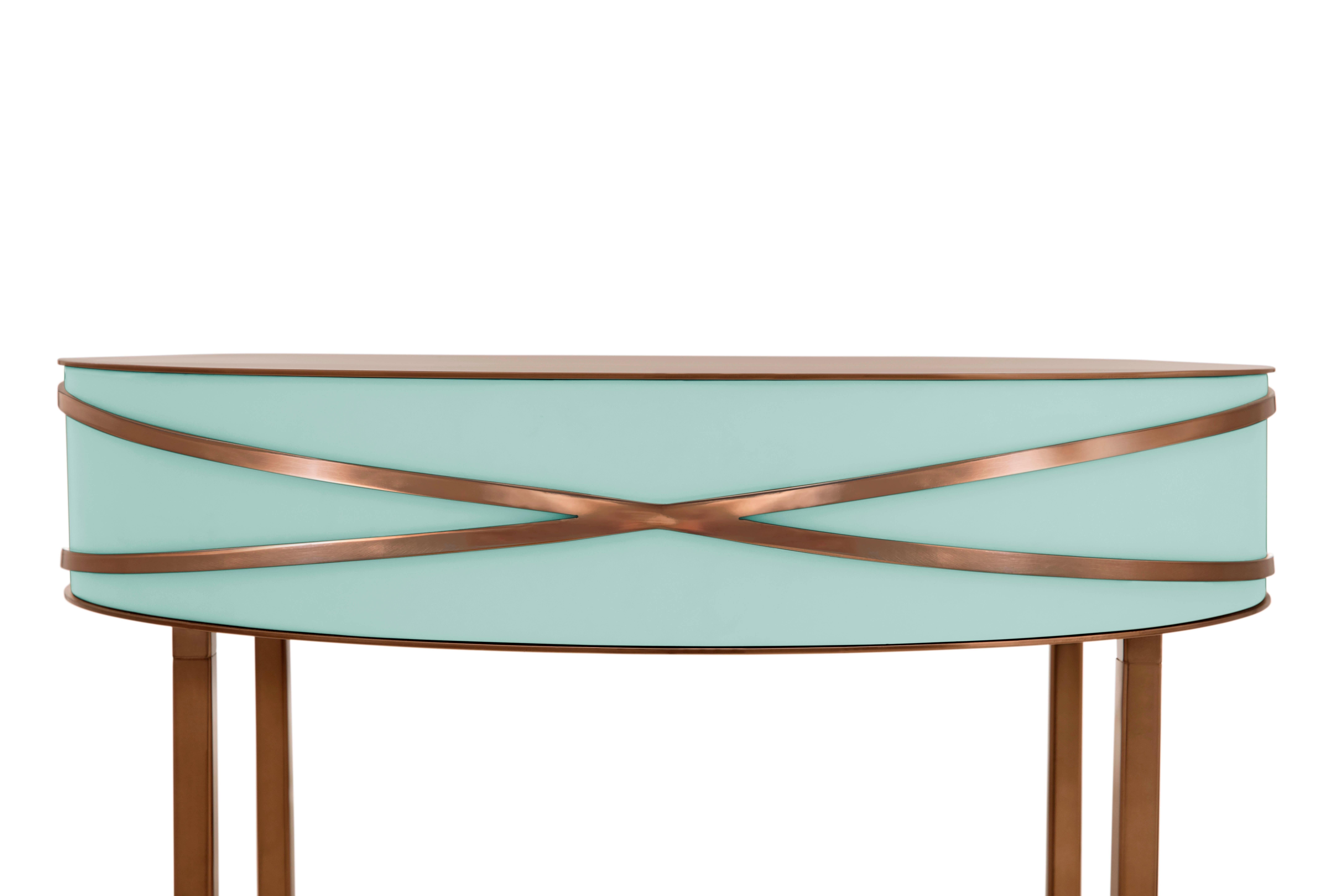 Stella Mint Green Console or Bedside Table with Rose Gold Trims by Nika Zupanc is a mint green console table with a drawer, and metal trims in rose gold.

Nika Zupanc, a strikingly renowned Slovenian designer, never shies away from redefining the
