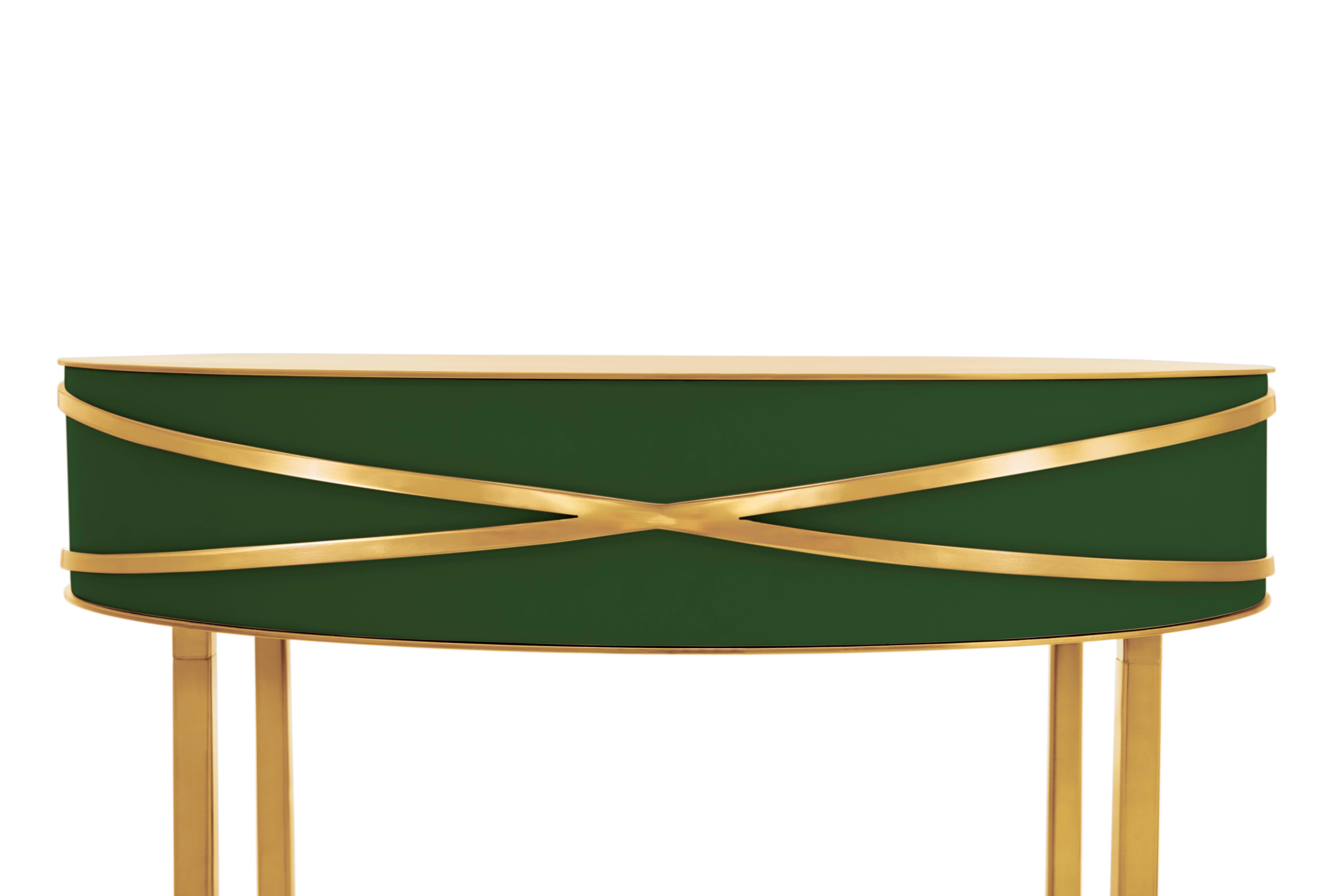 Stella Green Console or Bedside Table with Gold Trims by Nika Zupanc is a deep green console table with a drawer, and metal trims in gold.

Nika Zupanc, a strikingly renowned Slovenian designer, never shies away from redefining the status quo of