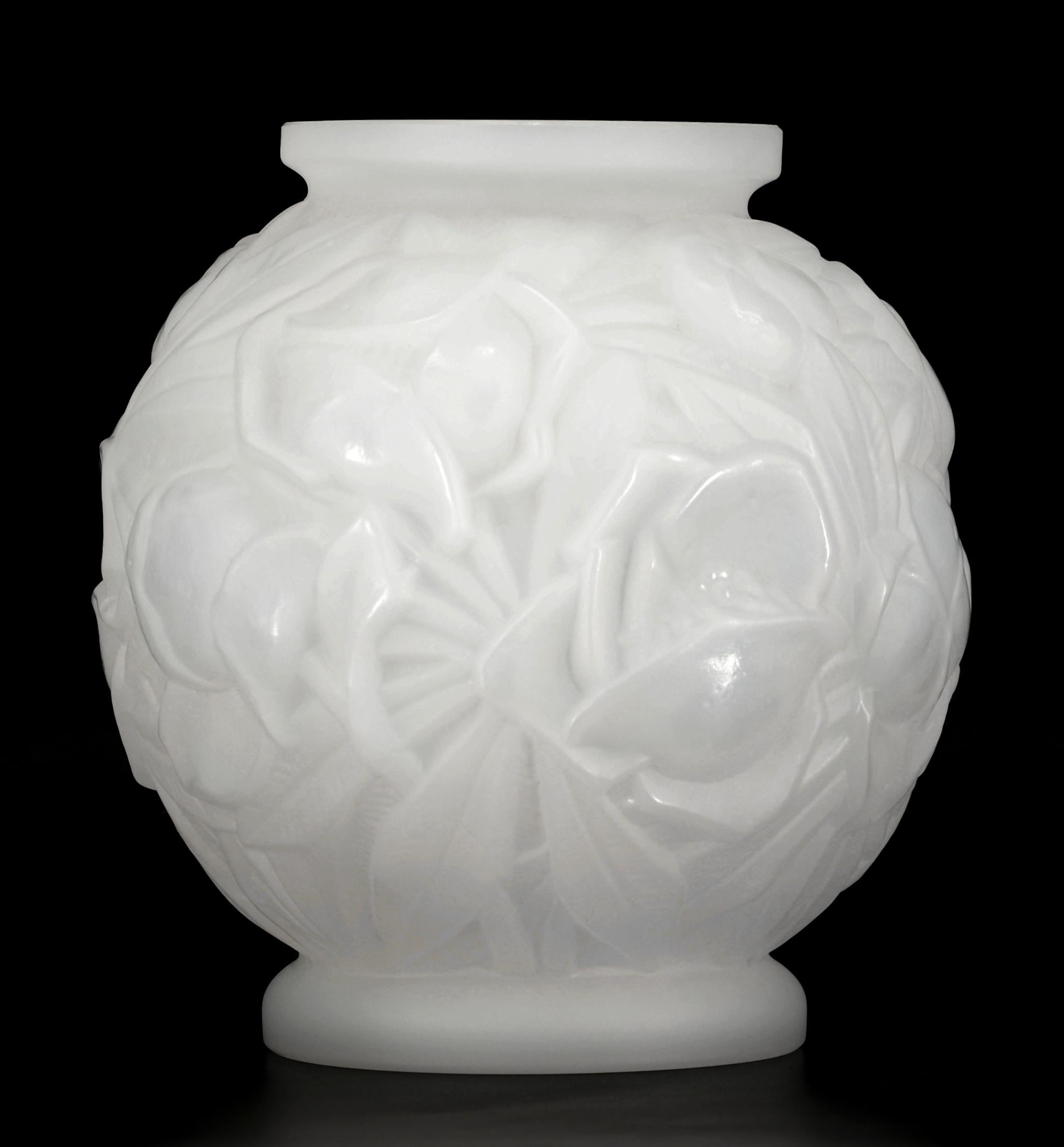 French Art Deco glass vase by STELLA, 42 rue des petites-écuries, Paris, France, ca.1930.. Rounded shaped vase. Thick frosted milky molded glass showing flowers. Height :7.5
