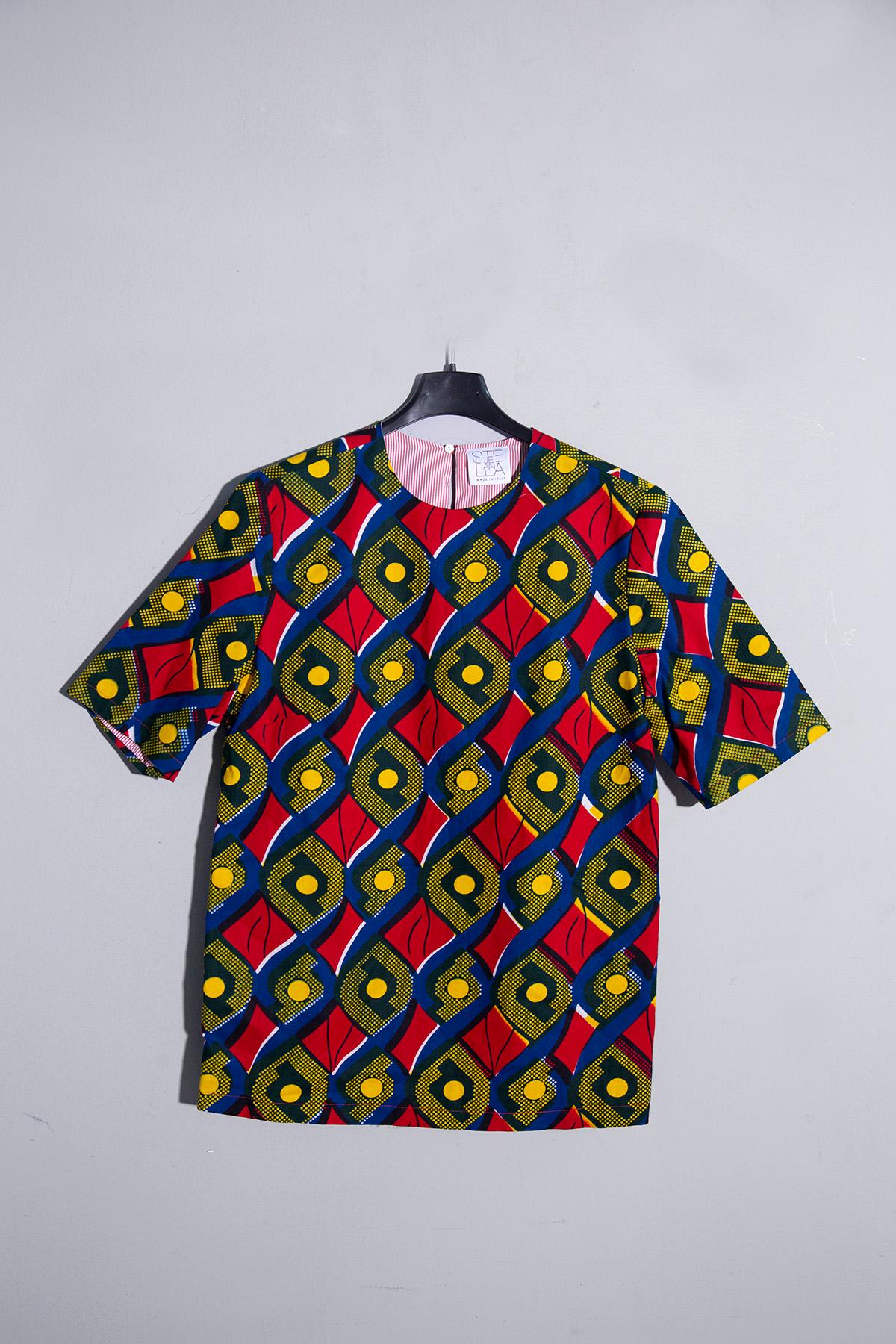 Embark on a sartorial journey to the heart of Africa with the STELLA Jean T-shirt from the circa 2014 collection. As you slip into its embrace, you'll be enveloped by the allure of regular, yet distinctly delineated shapes, evoking a sense of