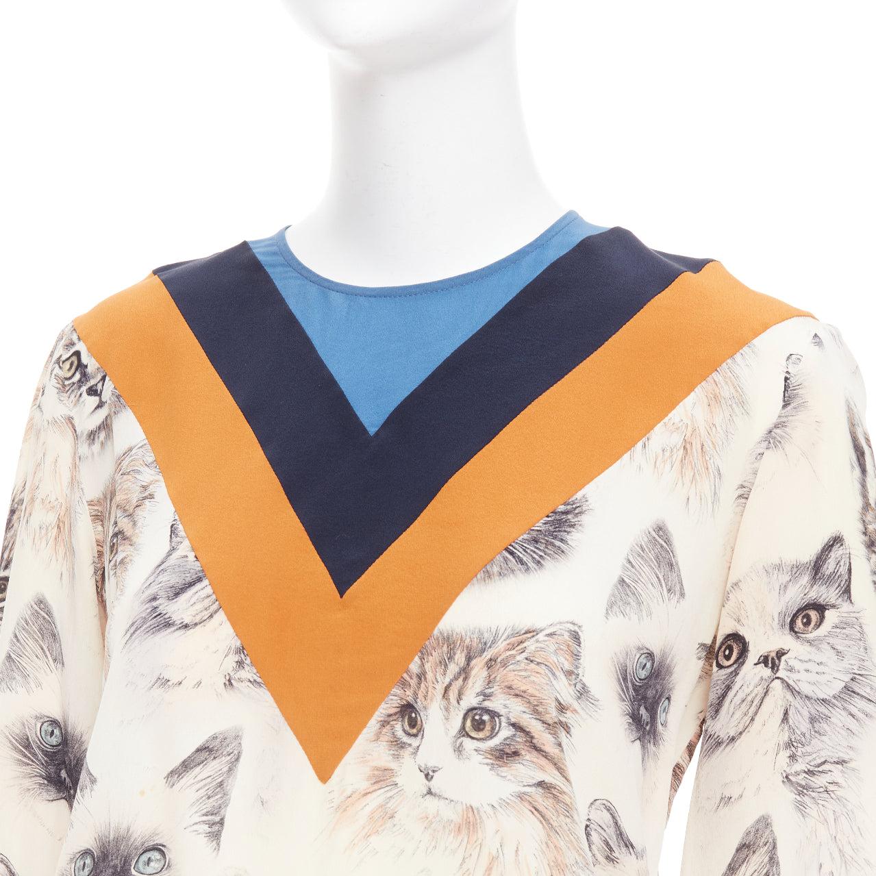 Stella McCartney 2016 100% seta  camicetta beige arancione con stampa gatto IT38 XS
Riferimento: GEGG/A00182
Marchio: Stella McCartney
Designer: Stella McCartney
Collezione: 2016
Materiale: Seta
Colore: Beige, Arancione
Schema: Gatti
Chiusura: