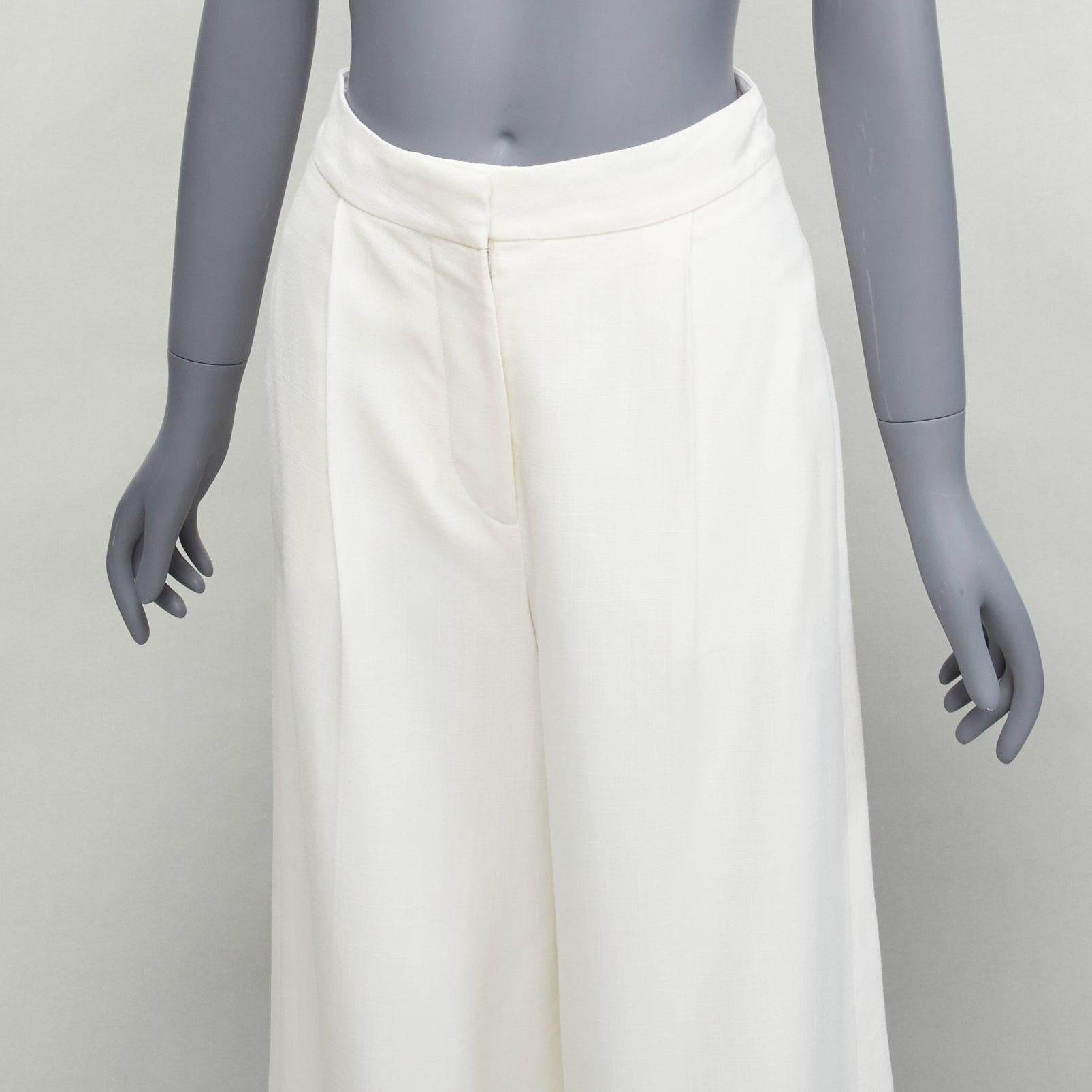 STELLA MCCARTNEY 2017 white silk lined front pleats culotte pants IT34 XXS
Reference: SNKO/A00295
Brand: Stella McCartney
Designer: Stella McCartney
Collection: 2017
Material: Viscose
Color: White
Pattern: Solid
Closure: Zip Fly
Lining: White