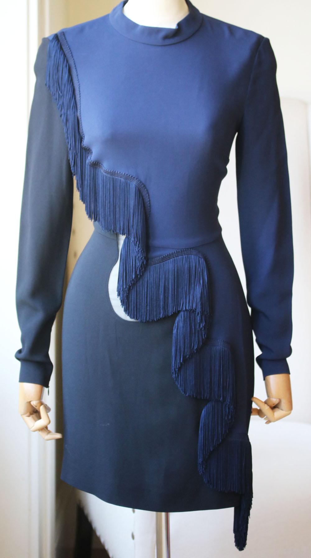 The mini length and slim fit of Stella McCartney's crepe 'Alba' dress is tempered by a swishy wave of fringing through the front.
This Italian-made style is also spliced with a sheer silk-organza panel at the waist.
Navy and black crepe.
Concealed