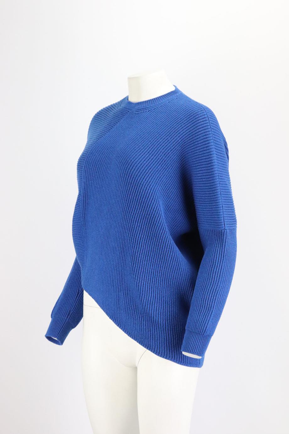This ribbed sweater by Stella McCartney is spun from wool, it has wide trims and a slit at the asymmetric hem. Blue wool. Slips on. 100% Virgin wool. Size: Small (UK 8, US 4, FR 36, IT 40). Bust measures approx. 57 inches. Waist measures approx. 44
