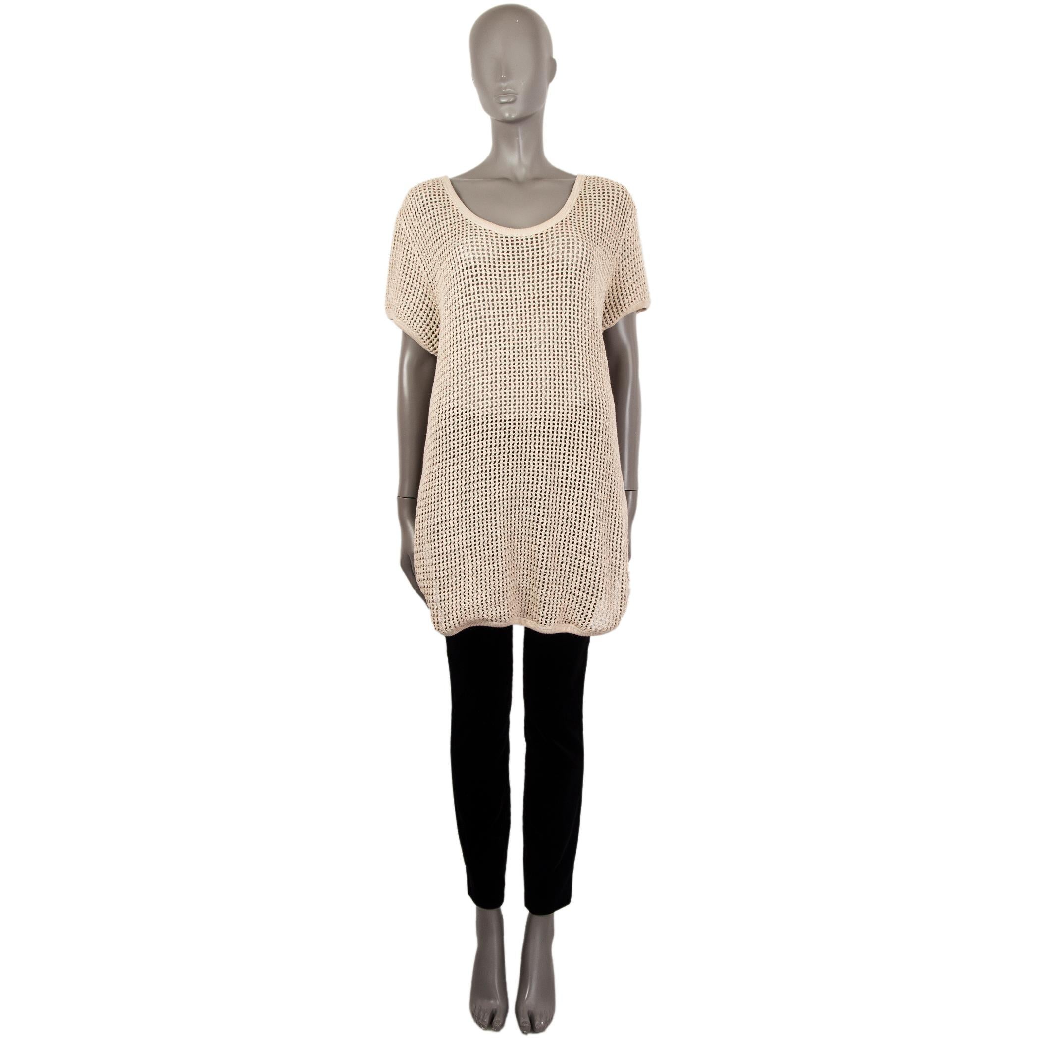 100% authentic Stella McCartney crochet long sweater in beige cotton (100%) with a scoop back, short sleeves and slits on the sides. Closes with two buttons and matching bar. Unlined. Has been worn and is in excellent condition.

Measurements
Tag