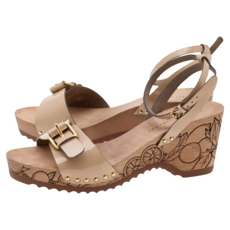 Stella McCartney's Linda wedges are set on a cork wedge sole and are secured with polished metal buckles at the front and ankle straps. This pair is crafted from the faux patent leather and comes with a durable rubber sole that provides comfort,