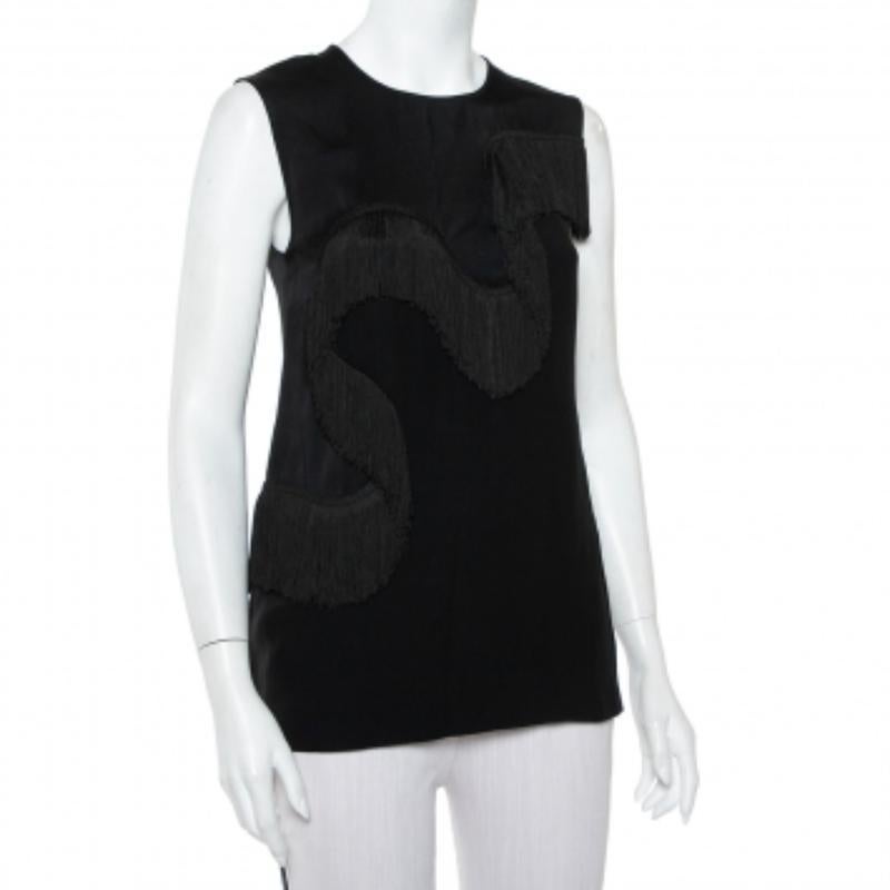 A statement-making top by Stella McCartney that can be worn under a blazer or just worn with pants and skirts. Tailored beautifully, the comfortable sleeveless top has a a swirl of fringes designed to move with you.
