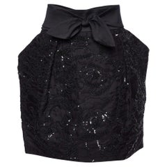 Stella McCartney mini-jupe noire embellie avec nœud papillon L