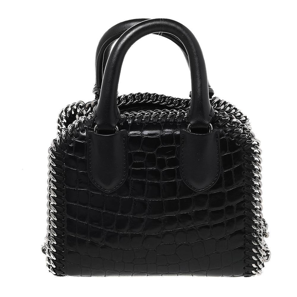 This Falabella bag from Stella McCartney will make the dream of countless women come true. Crafted from faux croc-embossed leather, it is durable and stylish and comes in a classic shade of black. It has dual handles, a shoulder strap, chain