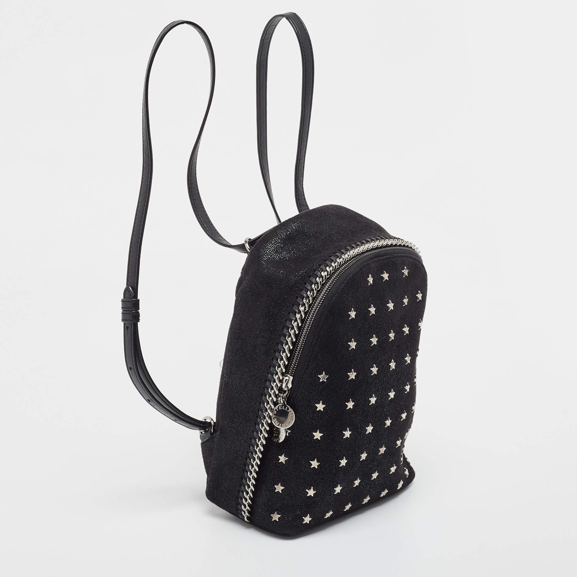 To accompany all your casual outings in the most fashionable way, Stella McCartney brings you this Falabella backpack that boasts fabulous style and details. It flaunts a black exterior with a front zip pocket and star & signature chain details.

