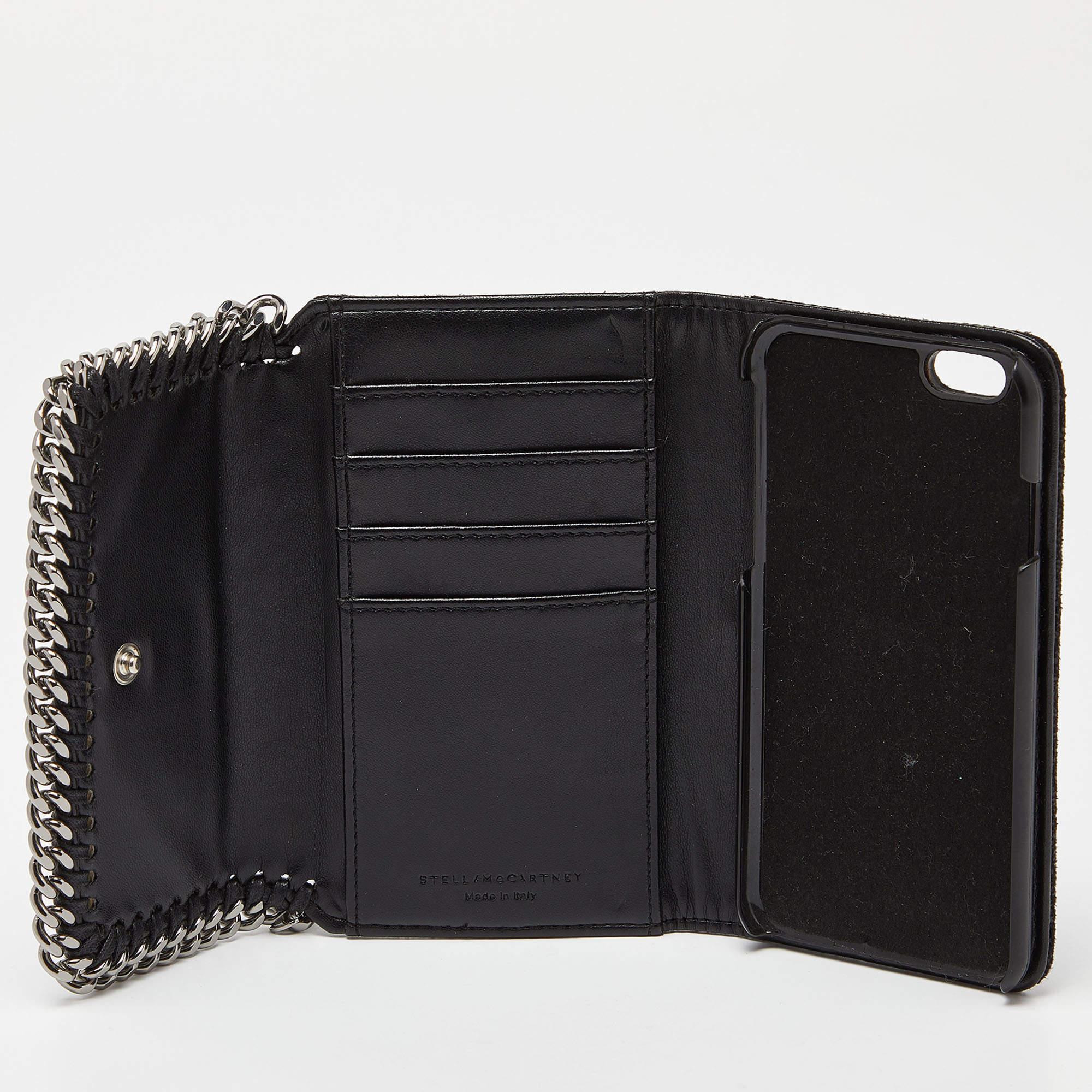 Stella McCartney's Falabella iPhone6 case is designed with signature chain details in a wallet style. It is made of faux leather and has a snap button closure.