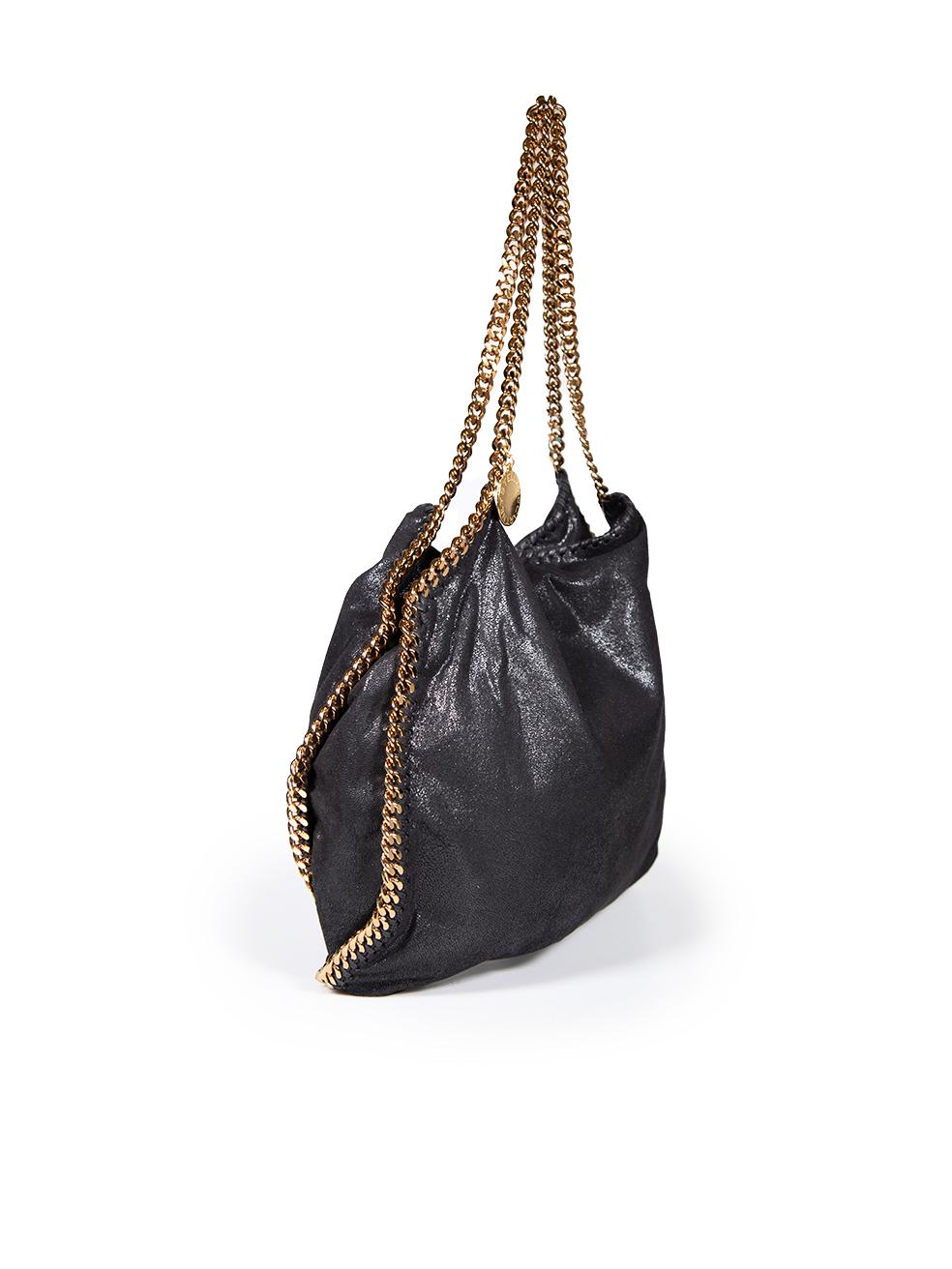 CONDITION is Very good. Minimal wear to tote is evident. Minimal scratch marks on the inside around the zip on this used Stella McCartney designer resale item.
 
 
 
 Details
 
 
 Model: Falabella
 
 Black
 
 Faux suede
 
 Medium tote bag
 
 Gold