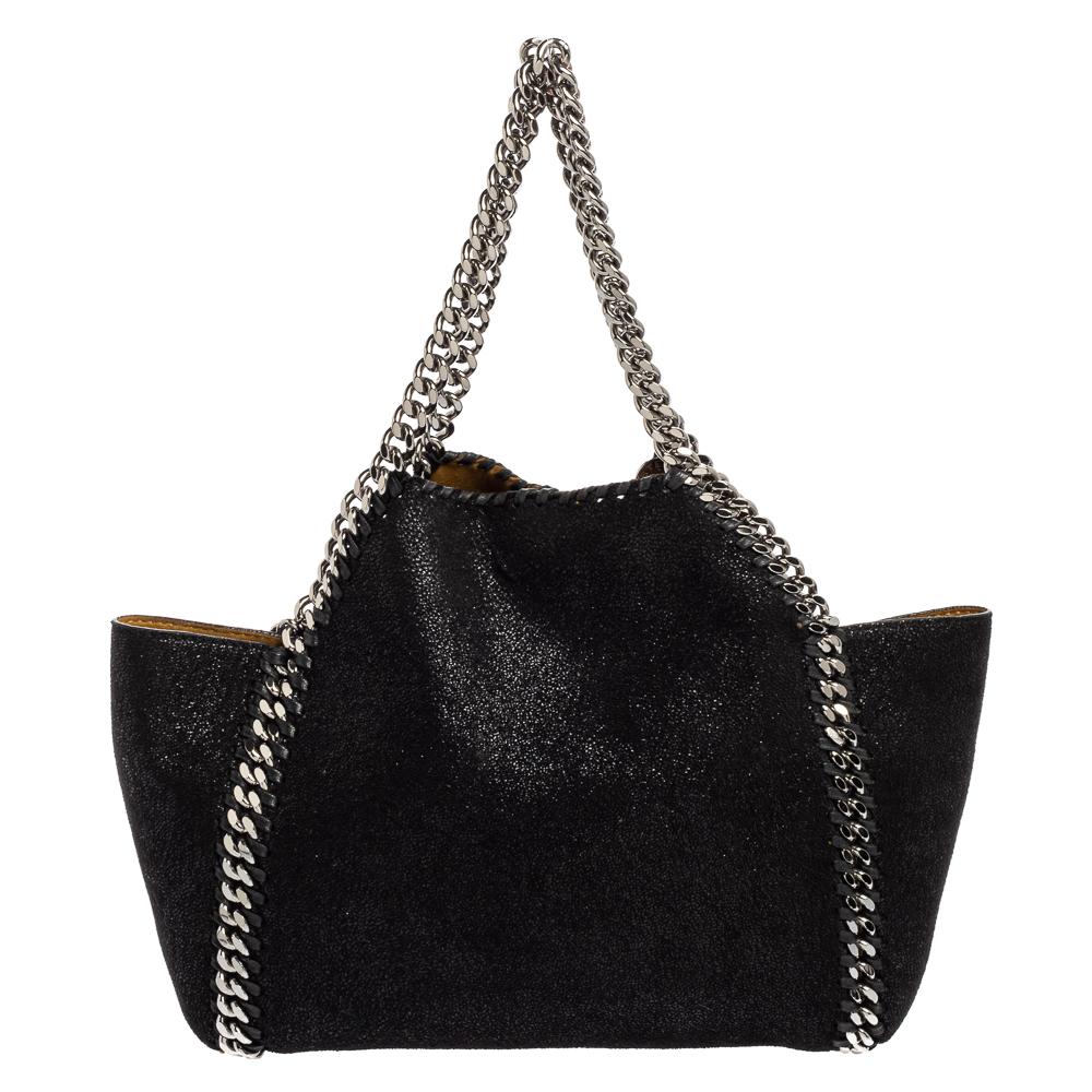 This Falabella bag from Stella McCartney is a beauty. Crafted from faux suede, it has a reversible design with one side in black and the other in mustard yellow. While the chain detailing elevates its beauty, the lined interior will dutifully hold
