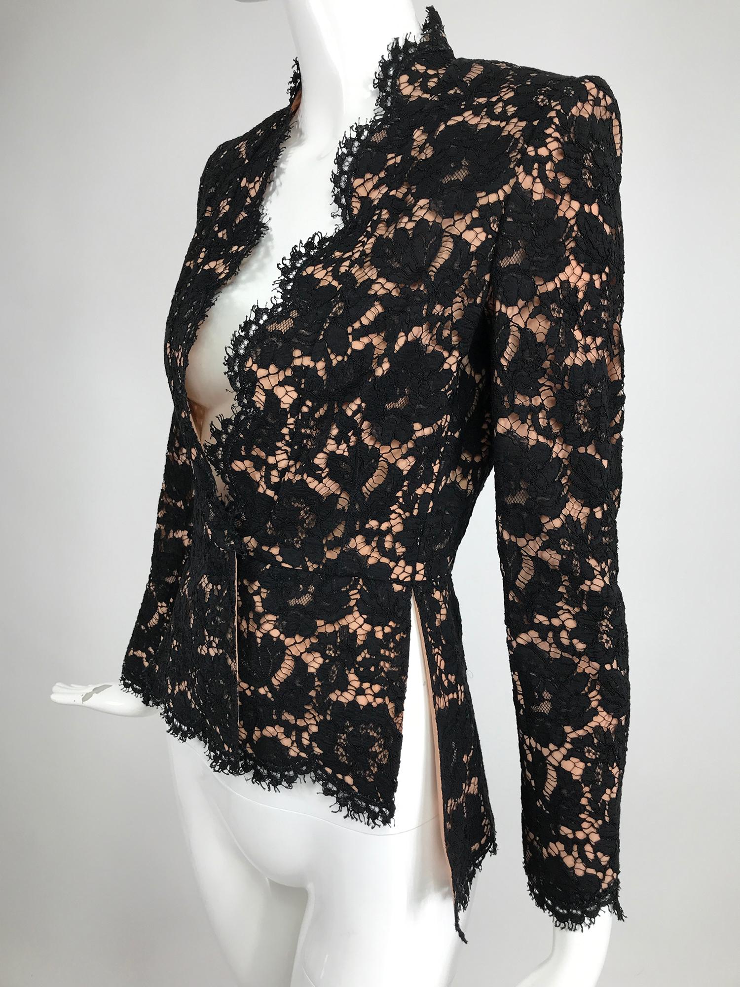 Stella McCartney black lace jacket with nude lining. This beautiufl jacket is unworn with tags. V neckline jacket with scallop facings, is fitted to the waist and flares to the hip, with side vents, longer in the back than the front. Long sleeves