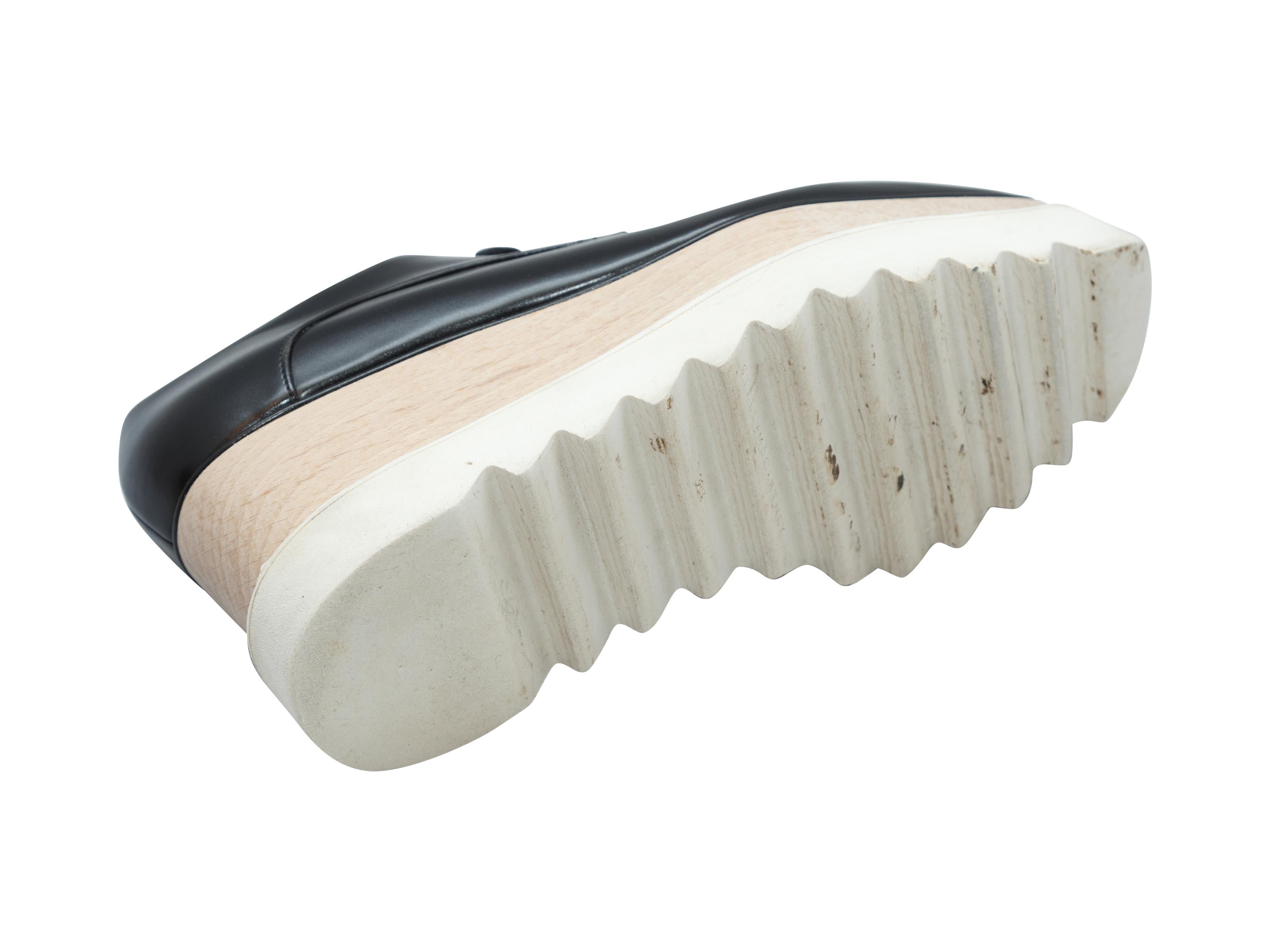 Product details: Black vegan leather platform oxfords by Stella McCartney. Wooden and rubber soles. Designer size 38.5. 3
