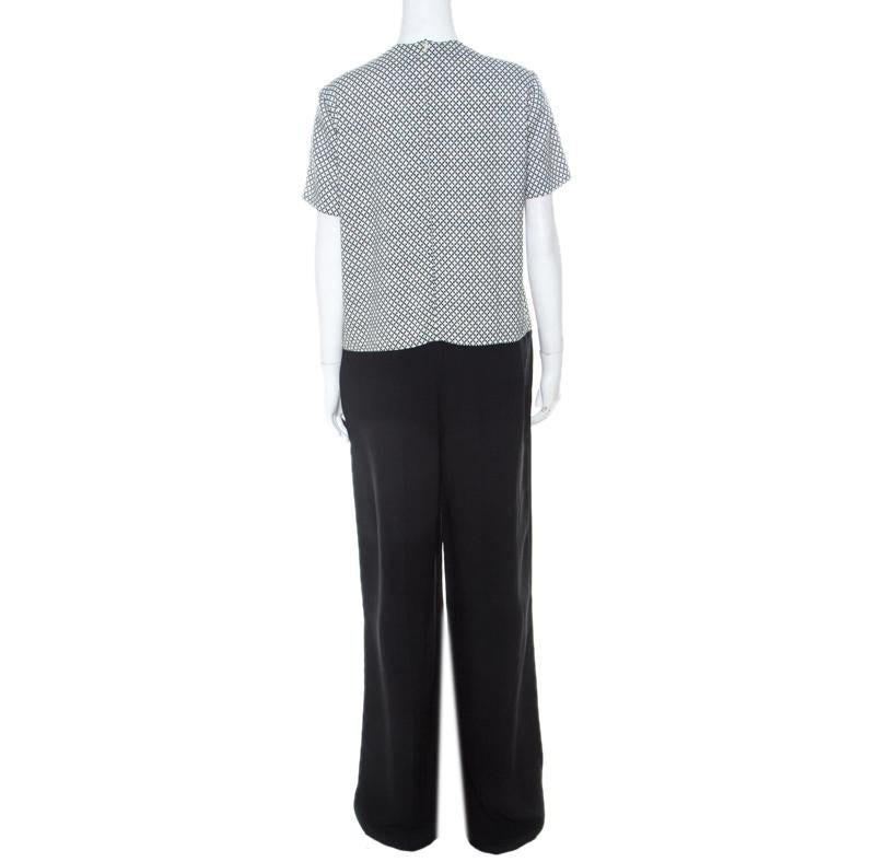 Made from quality fabrics, this jumpsuit by Stella McCartney has been designed to look like separates. It features a printed, short sleeve bodice and black pants. Style this jumpsuit with a belt and high heels for a fashionable