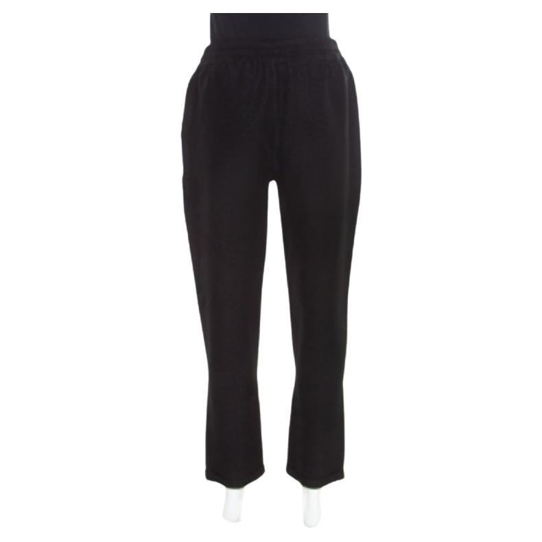 Now lounge around in comfort and style in these pants from Stella McCartney! The black pants are made of rayon and feature a drawstring detailing on the waistband. They come equipped with two external pockets and are sure to lend you a great fit.