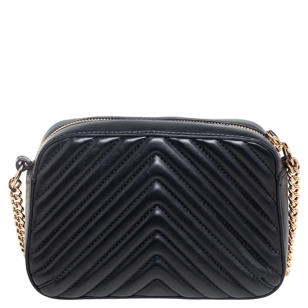 Coming from the House of Stella McCartney, this Stella Star crossbody bag will help your style sparkle! It is made from black quilted faux leather on the exterior and comes with a gold-toned star motif embellishment on the front. It has a faux